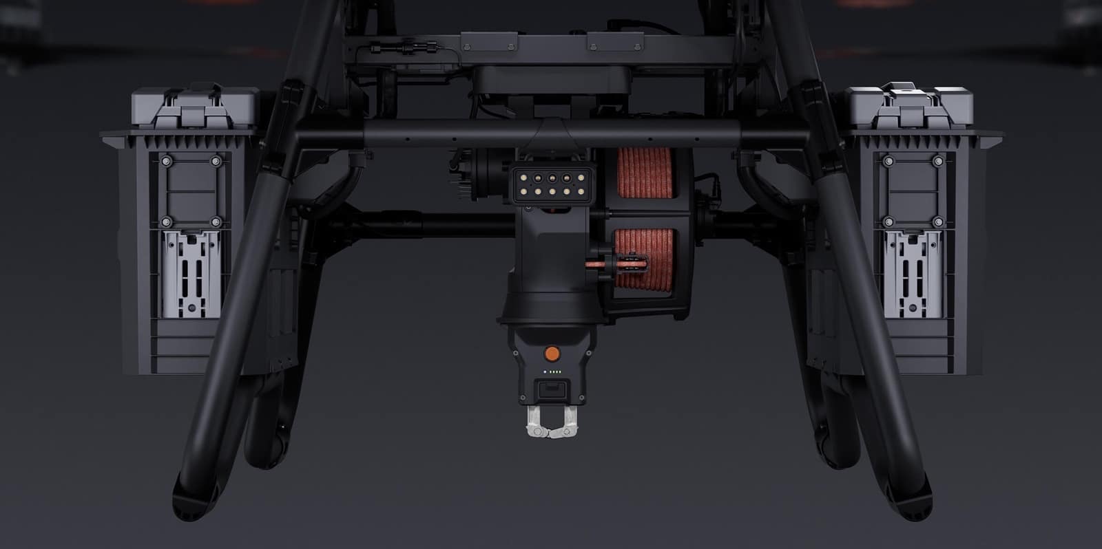 Underside of the airframe showing twin battery bays and the central winch hook.