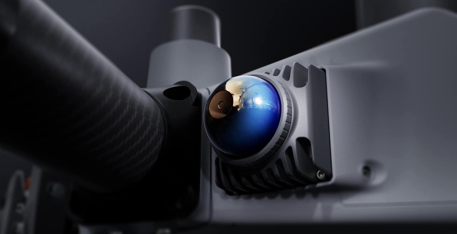Blue-tinted fisheye vision camera set into the fuselage beside a propeller arm.