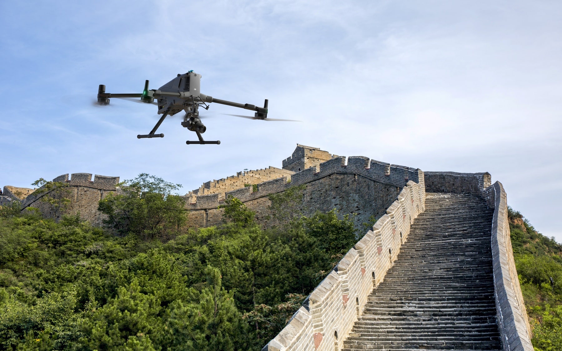 The Matrice 400 flies above a restored stone section of the Great Wall.