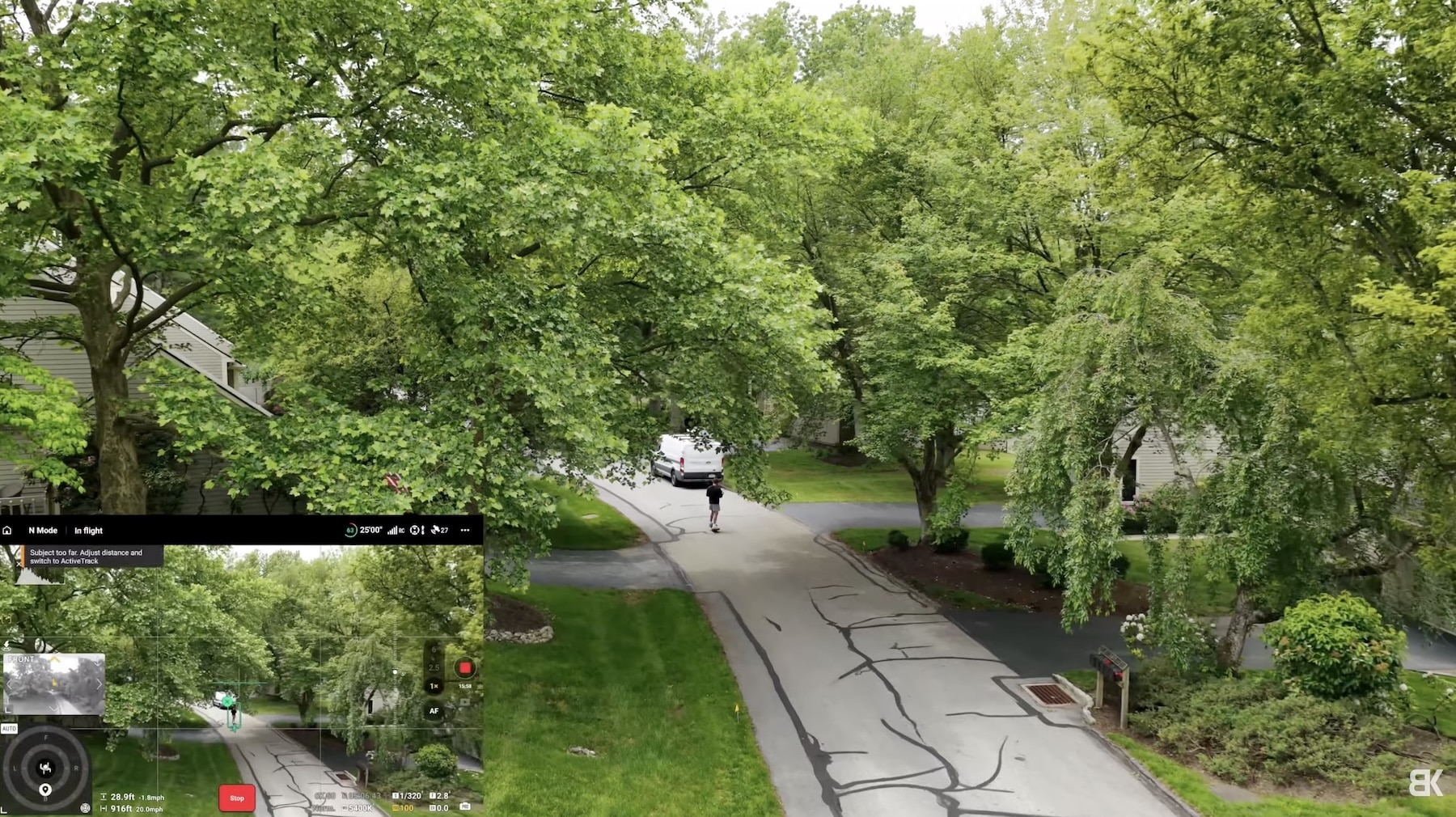 The drone tracks a rider along a tree-lined driveway, map inset bottom left.