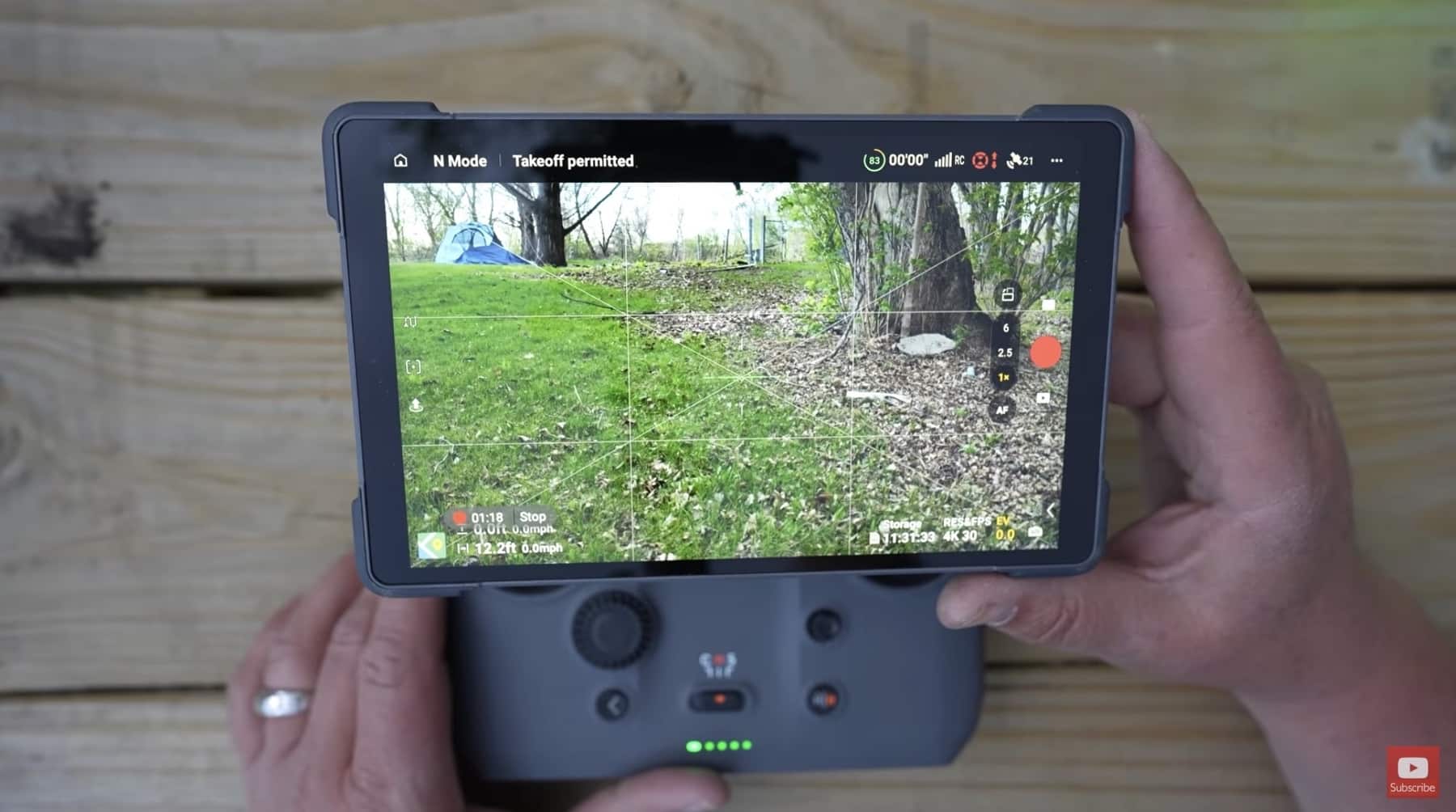 DJI RC Pro 2 held in hand, noticeably bulkier than the RC 2.