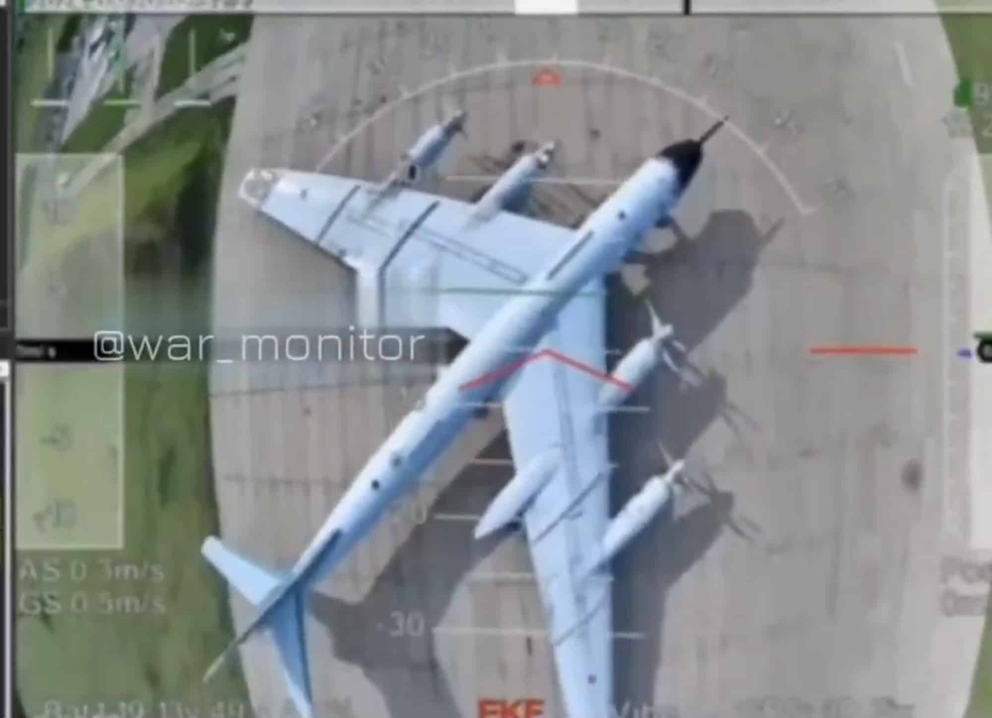 Strike-camera view of a parked Tu-95 bomber with a targeting overlay.
