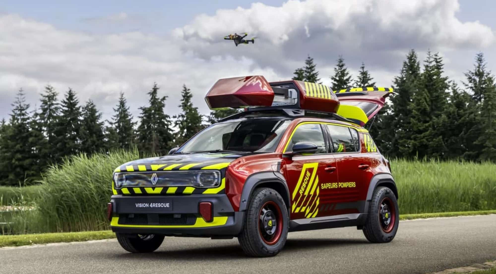 The red Sapeurs-Pompiers concept car photographed with its drone airborne overhead.