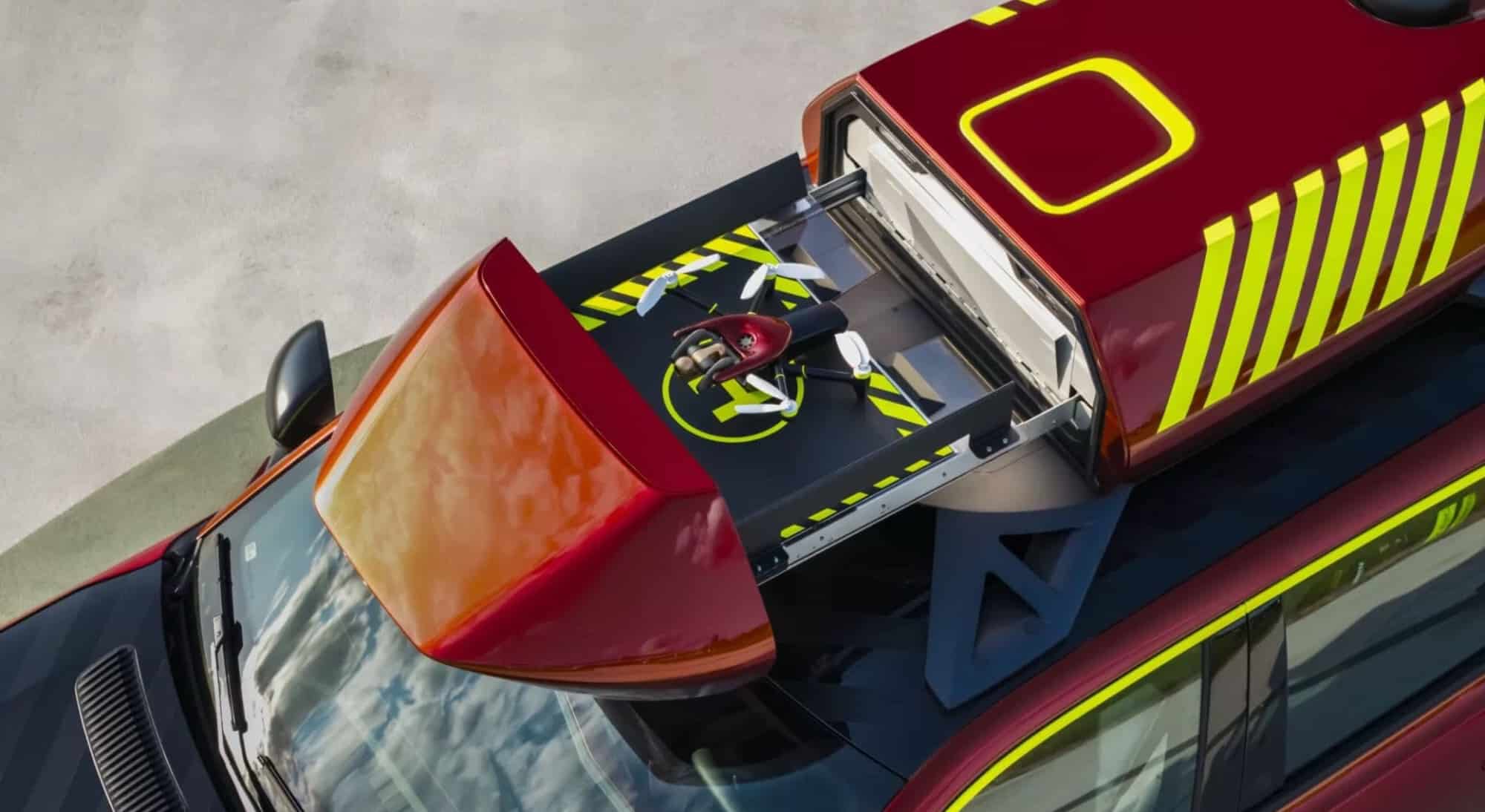 Close-up of the roof-mounted drone pod on the rescue vehicle yellow-striped bodywork.