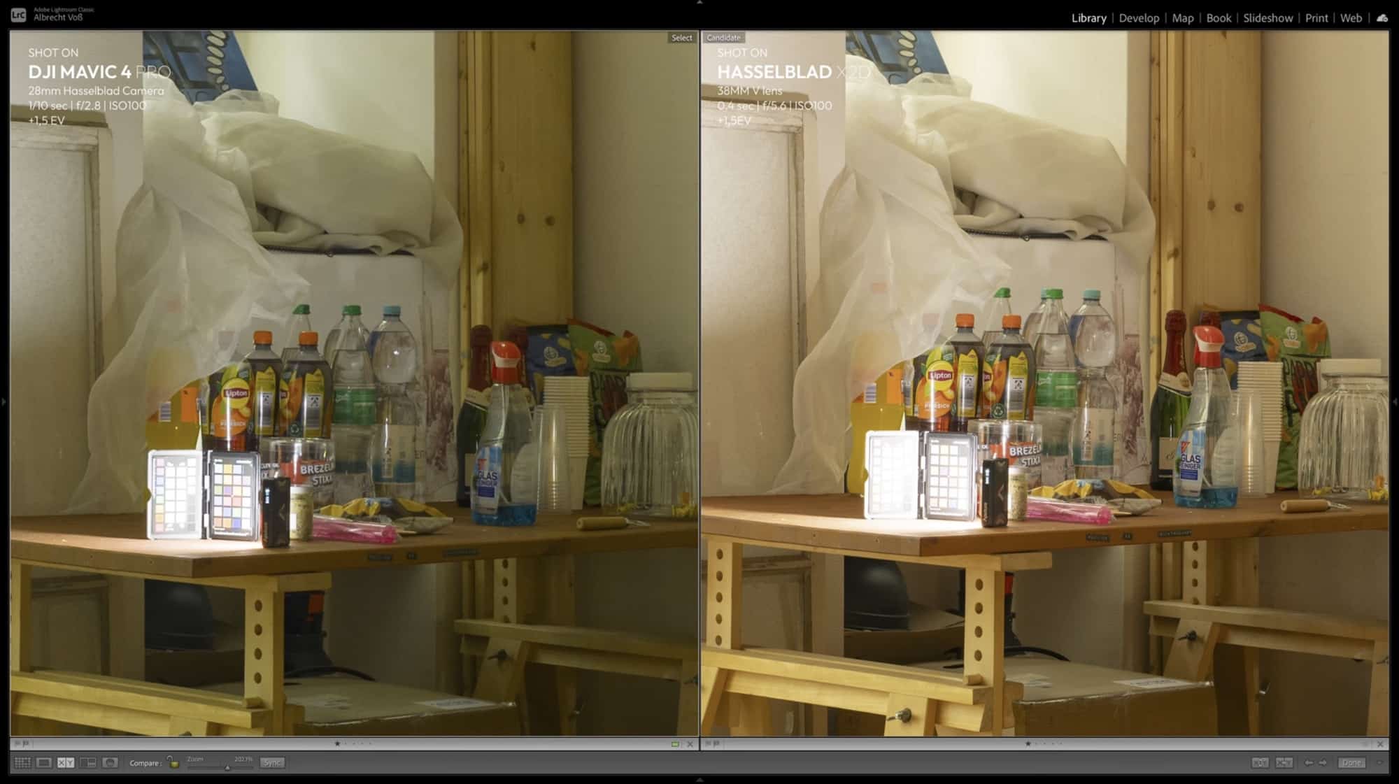 Bottles and jars on a workbench under white fabric, drone and X2D color test.