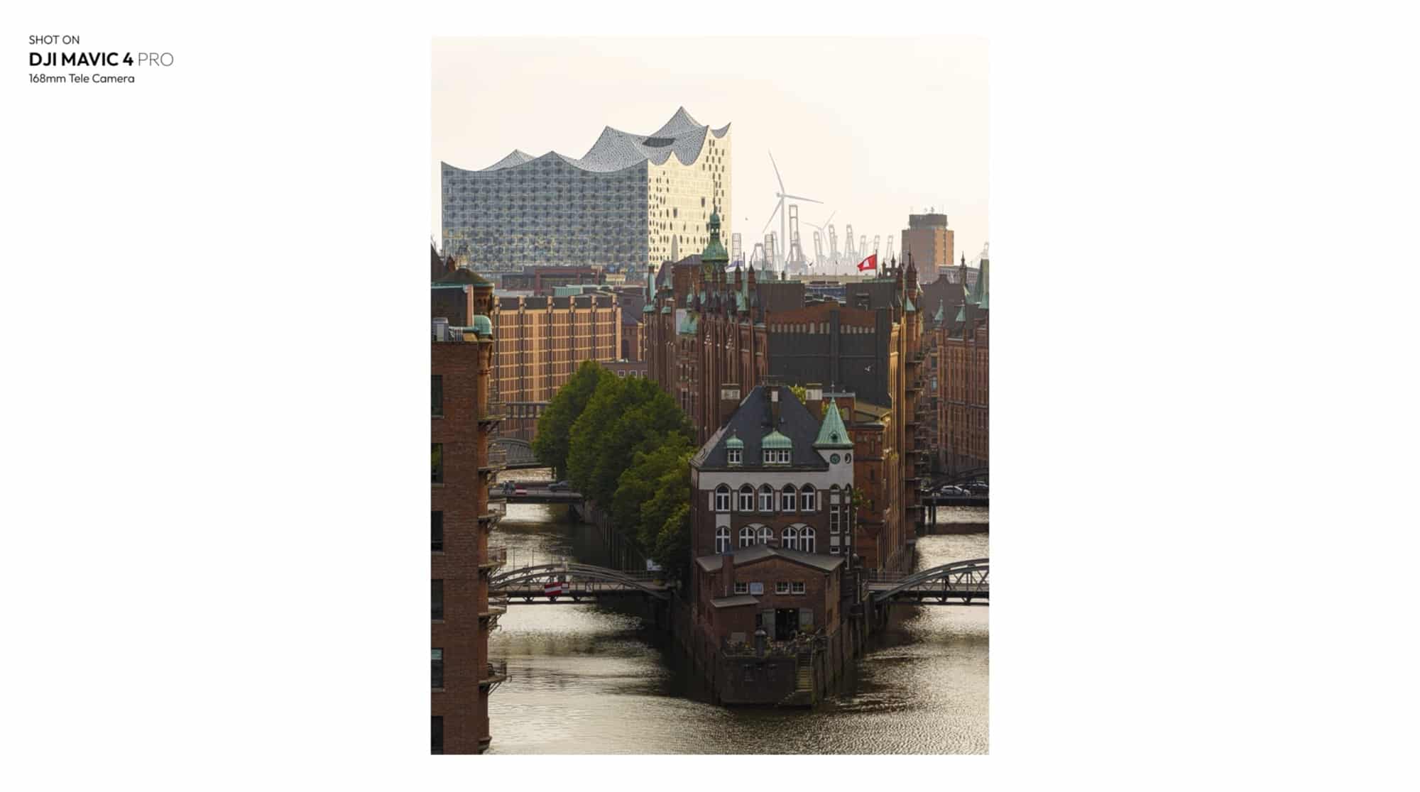 Vertical 168mm frame of the moated Speicherstadt warehouse with the concert hall behind.
