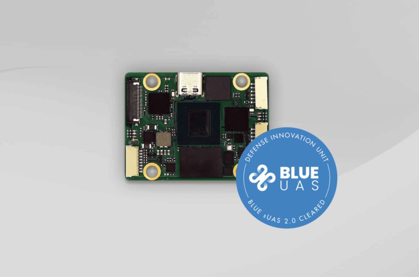Green Skynode circuit board with a Blue UAS Cleared badge from the Defense Innovation Unit.