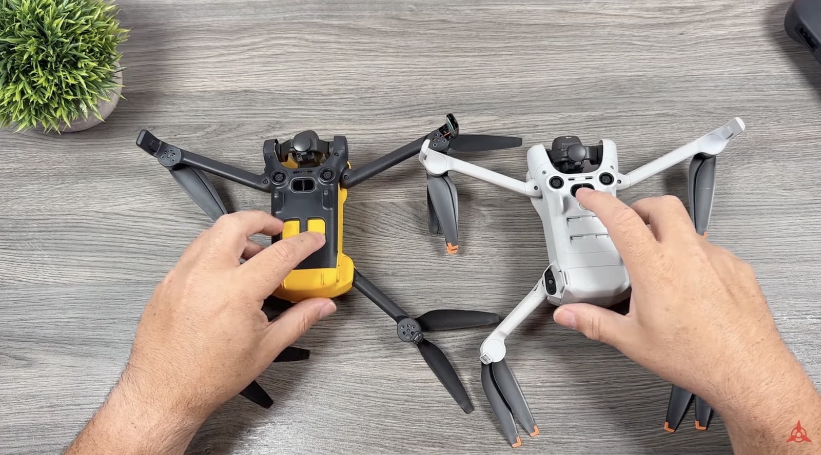 Undersides of both drones compared, with no LED light on the SkyRover.