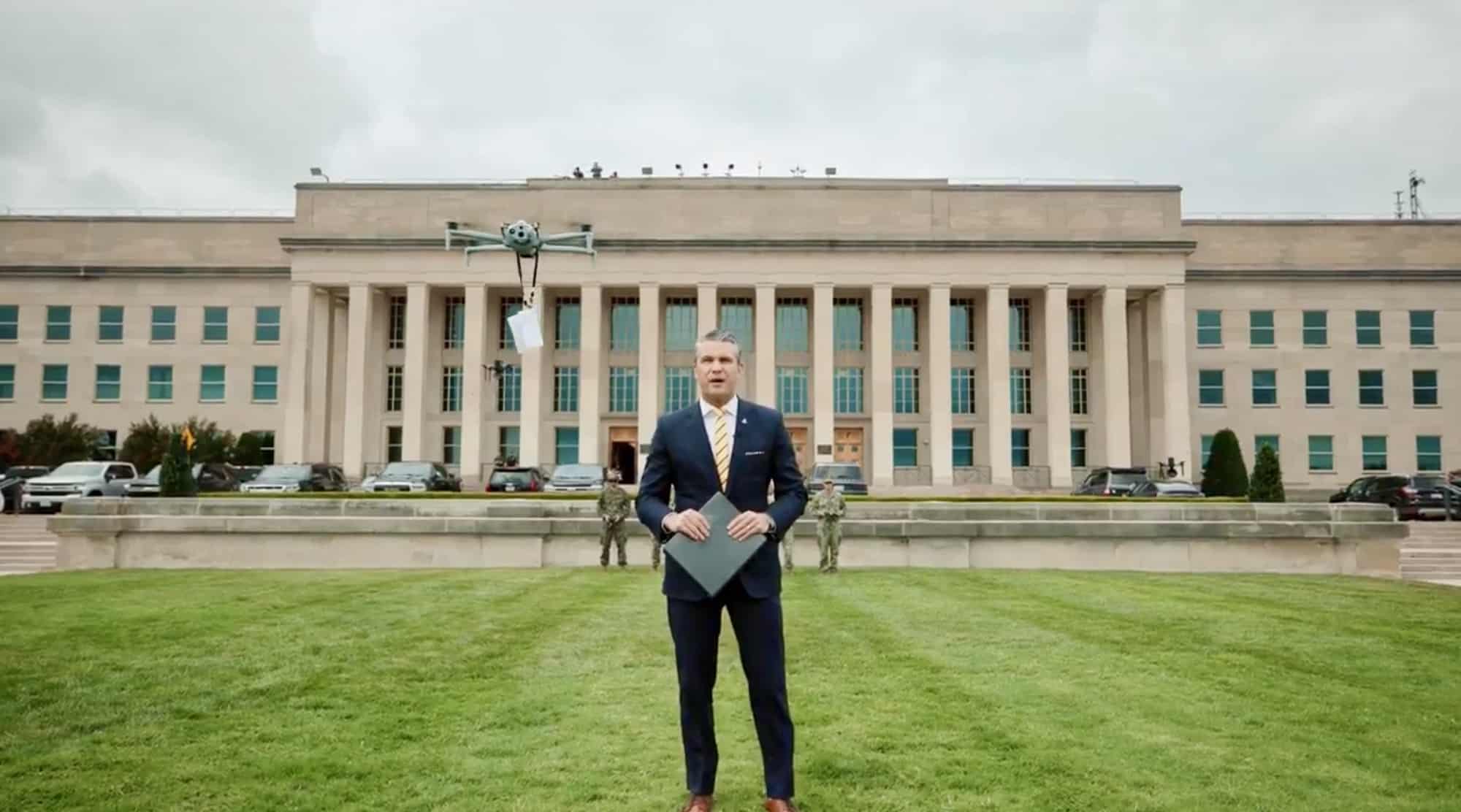 The defense secretary speaks on the Pentagon lawn as a small quadcopter hovers nearby.