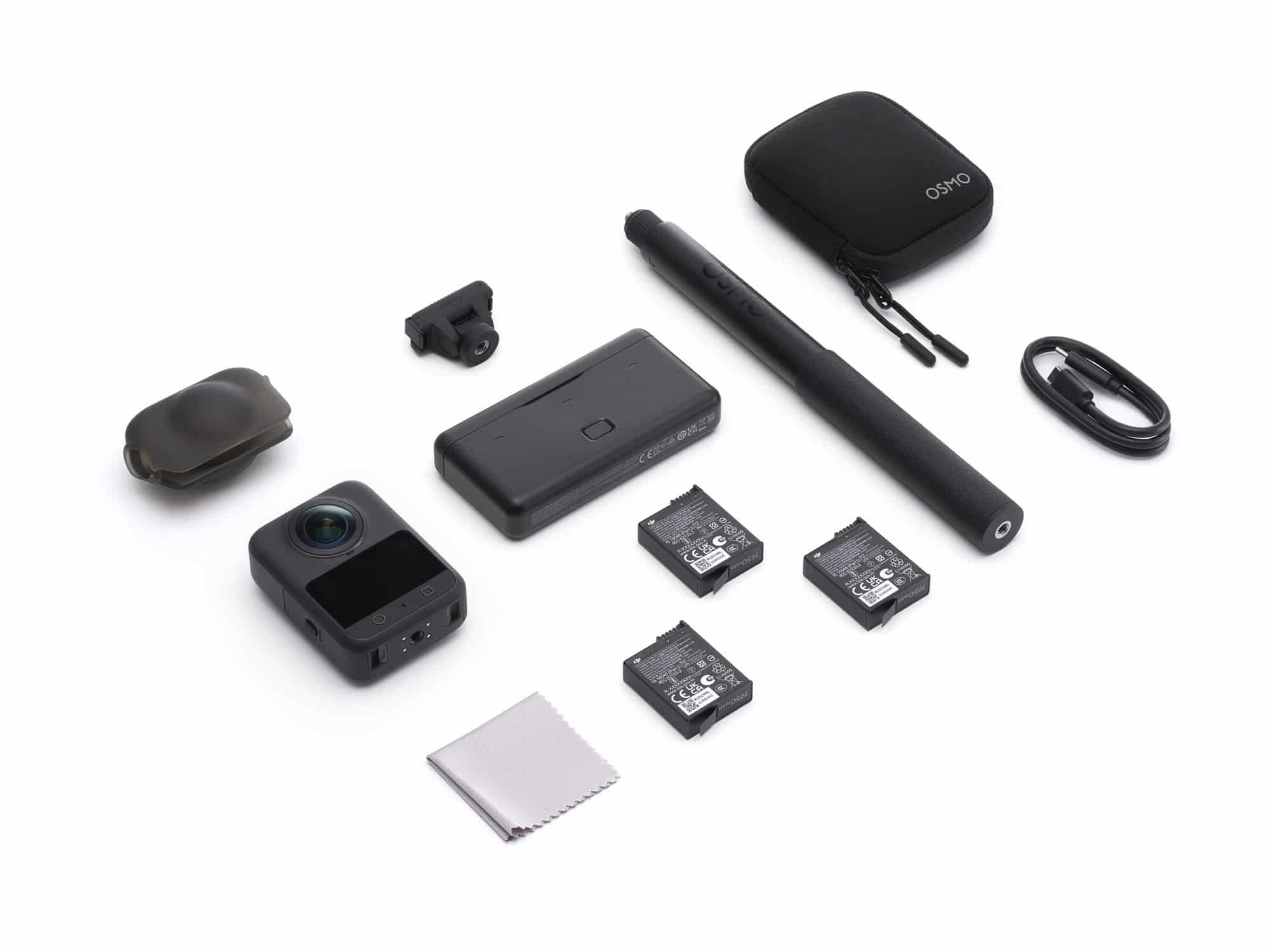 Flat lay of the Adventure Combo with camera, three batteries, stick, case and cable.