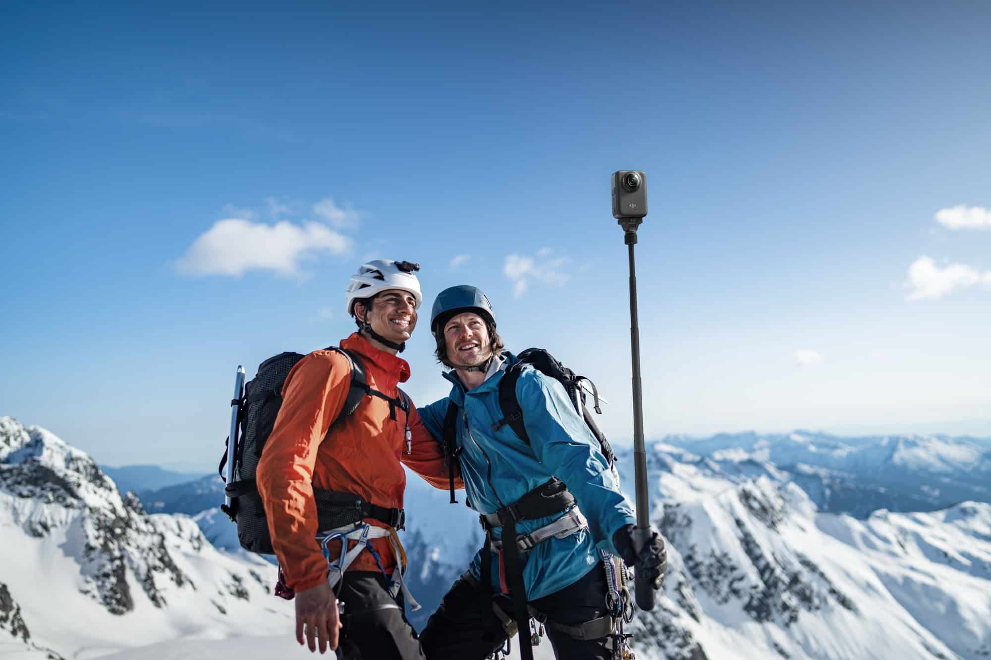 A mountaineer carrying the DJI Osmo 360 on a climb, from DJI's launch imagery.