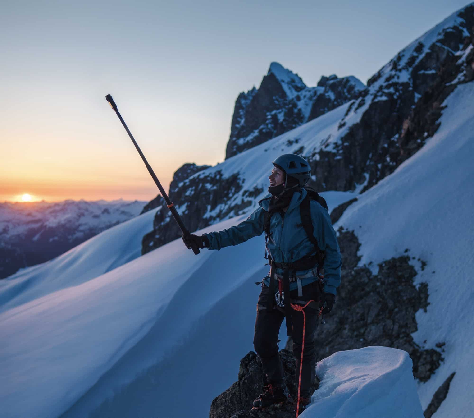 The Osmo 360 mounted on a climber's pack, recording native 8K panoramic footage.