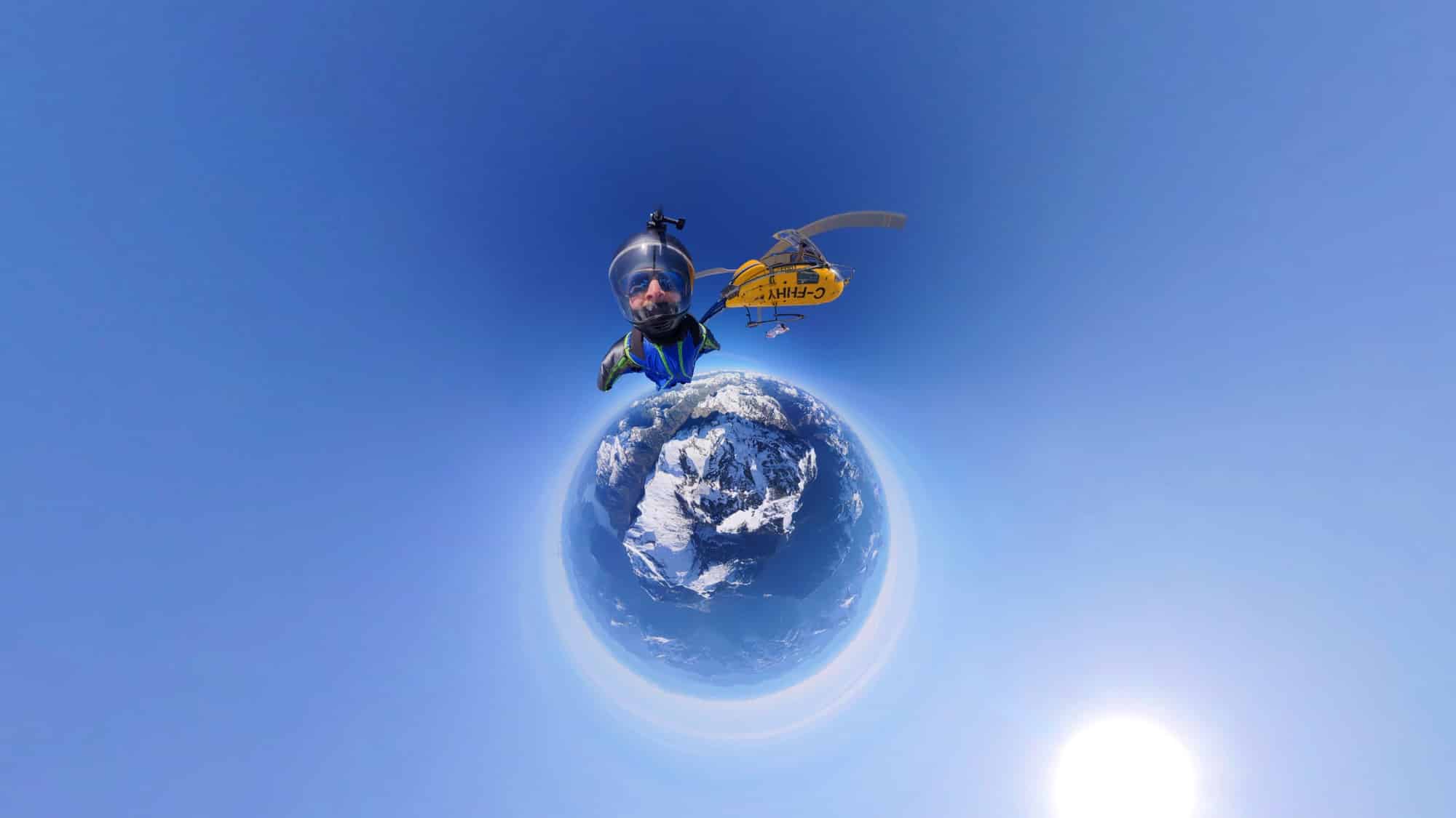 Tiny-planet frame of a speed rider soaring above a curved snowy world.