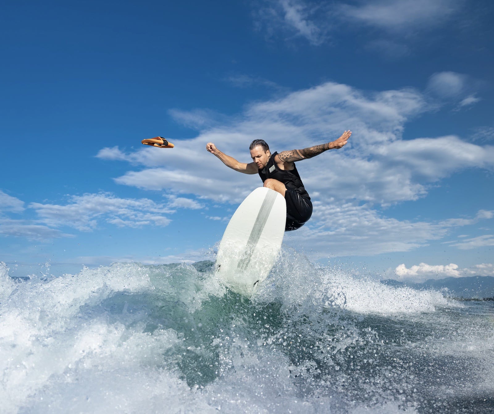 The HoverAir AQUA floating on the water surface before taking off.