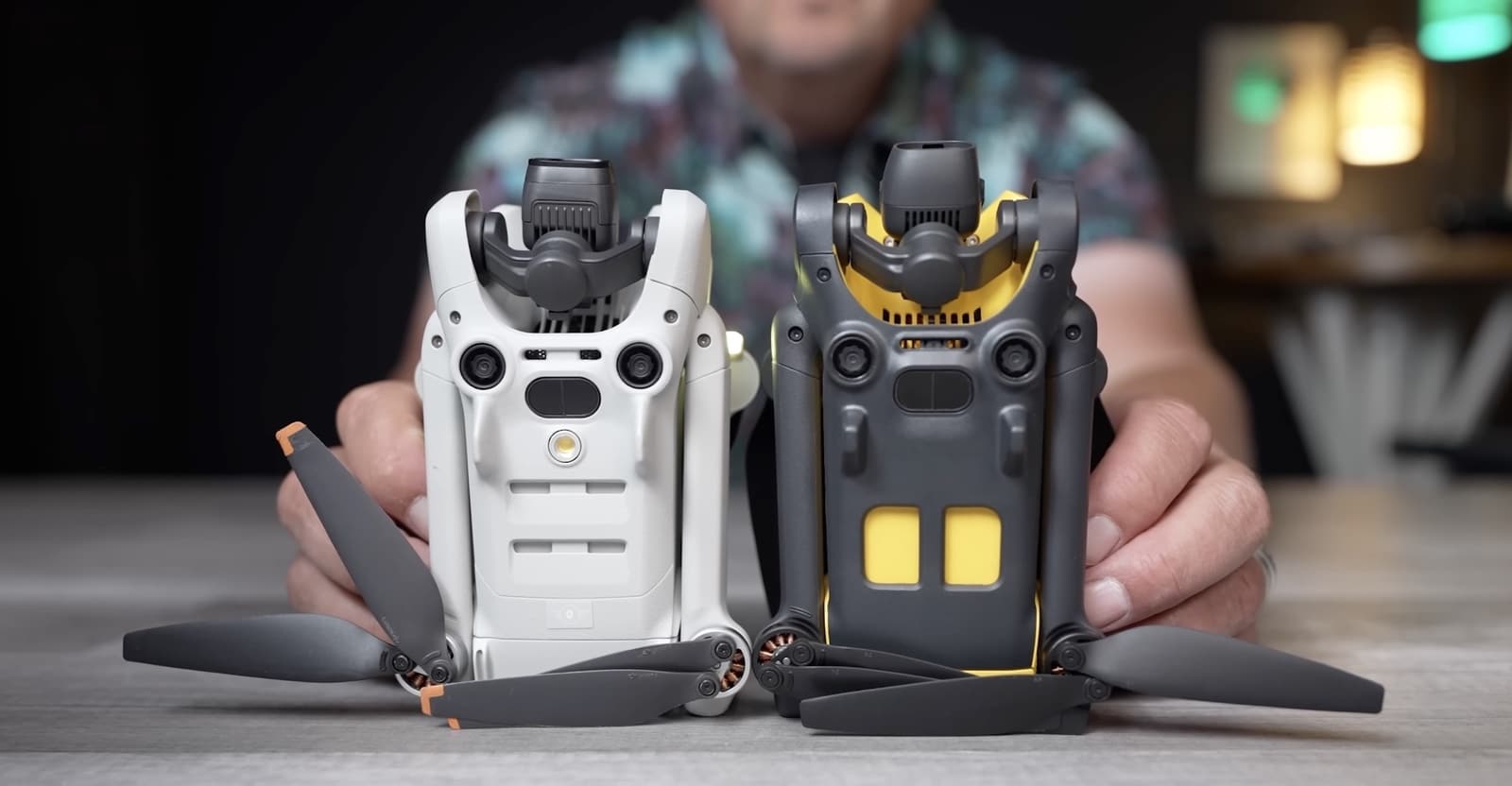 Unfolded SkyRover X1 and DJI Mini shown side by side with their controllers.