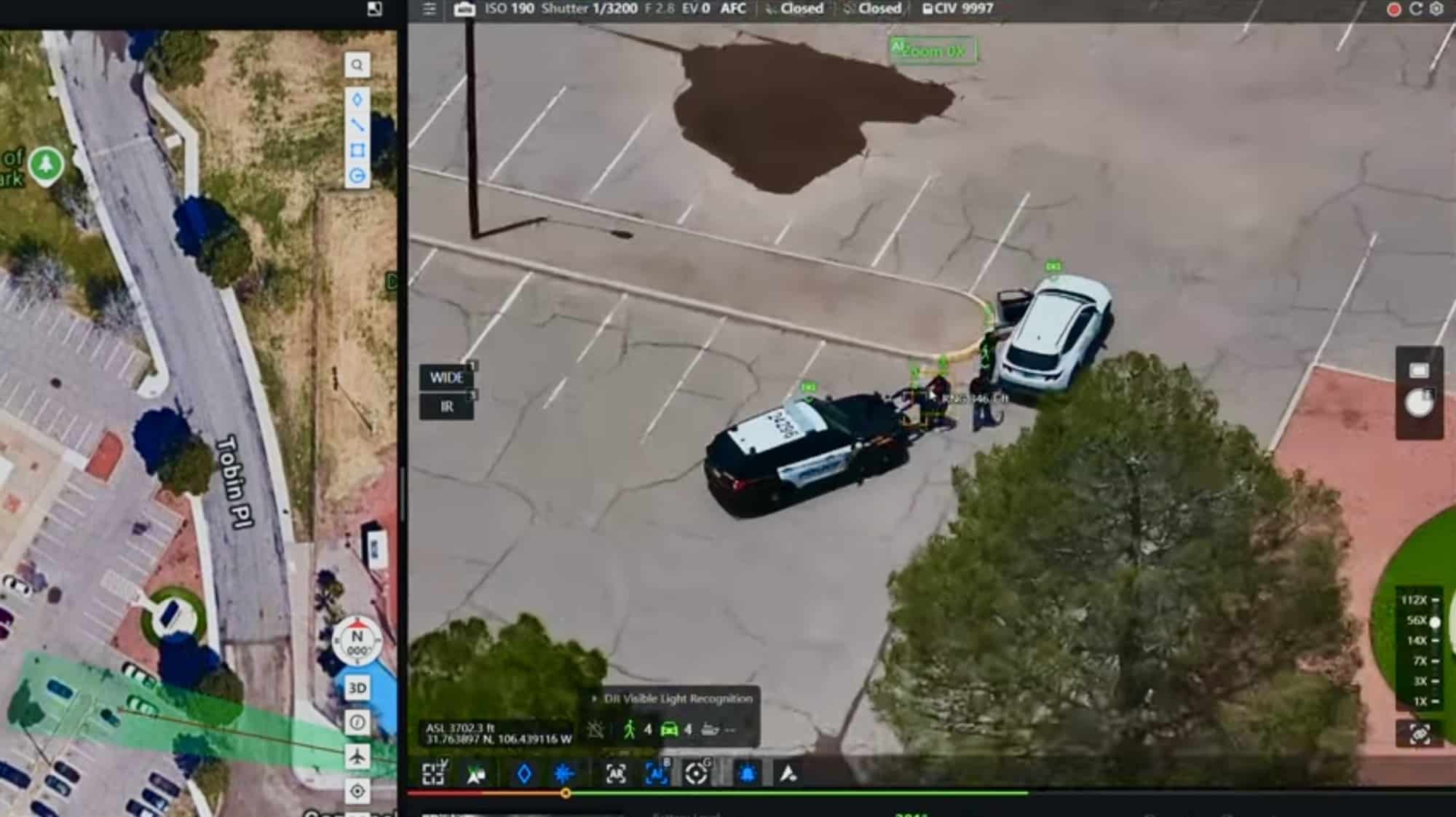 FlightHub 2 interface pairing a street map with live drone video of a traffic stop.