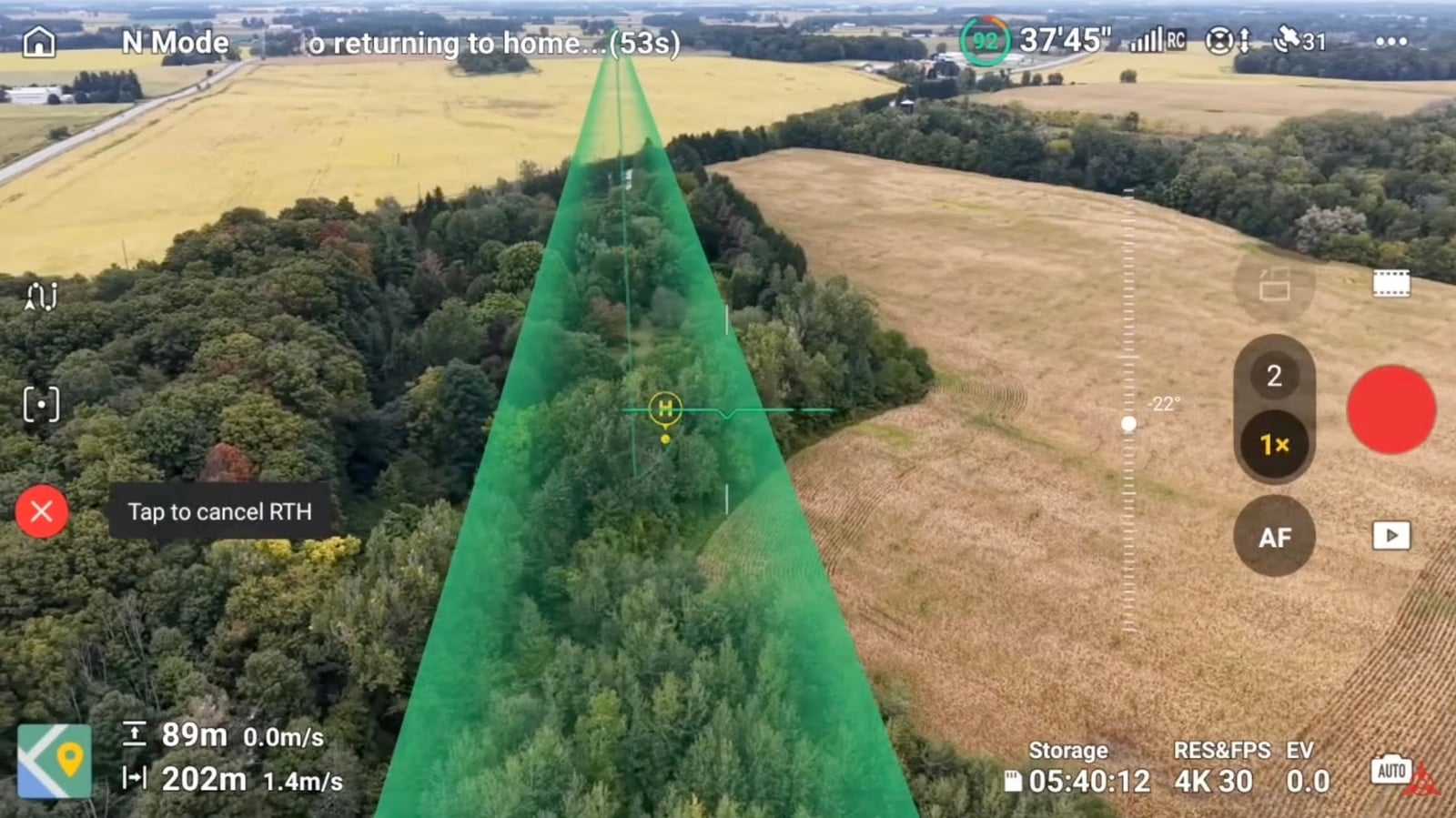 Flight app screenshot showing the return-to-home corridor drawn in green over farmland.
