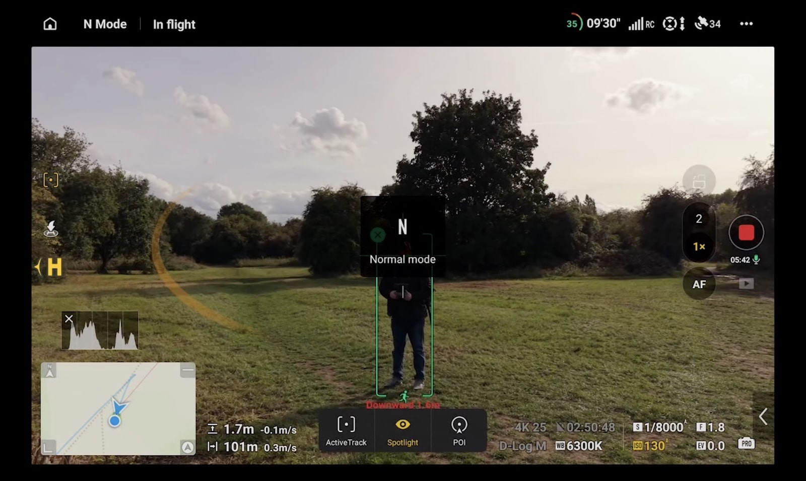 The Mini 5 Pro tracking a subject through a densely wooded area.