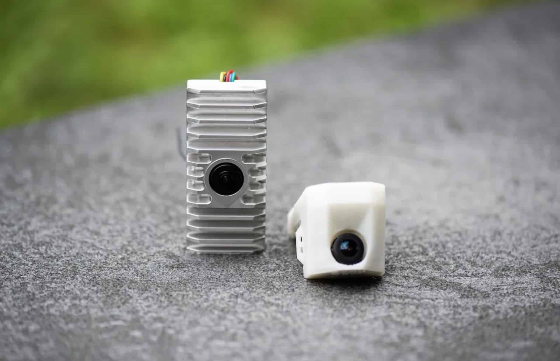 NORDA autonomy module and stabilization camera resting on asphalt.