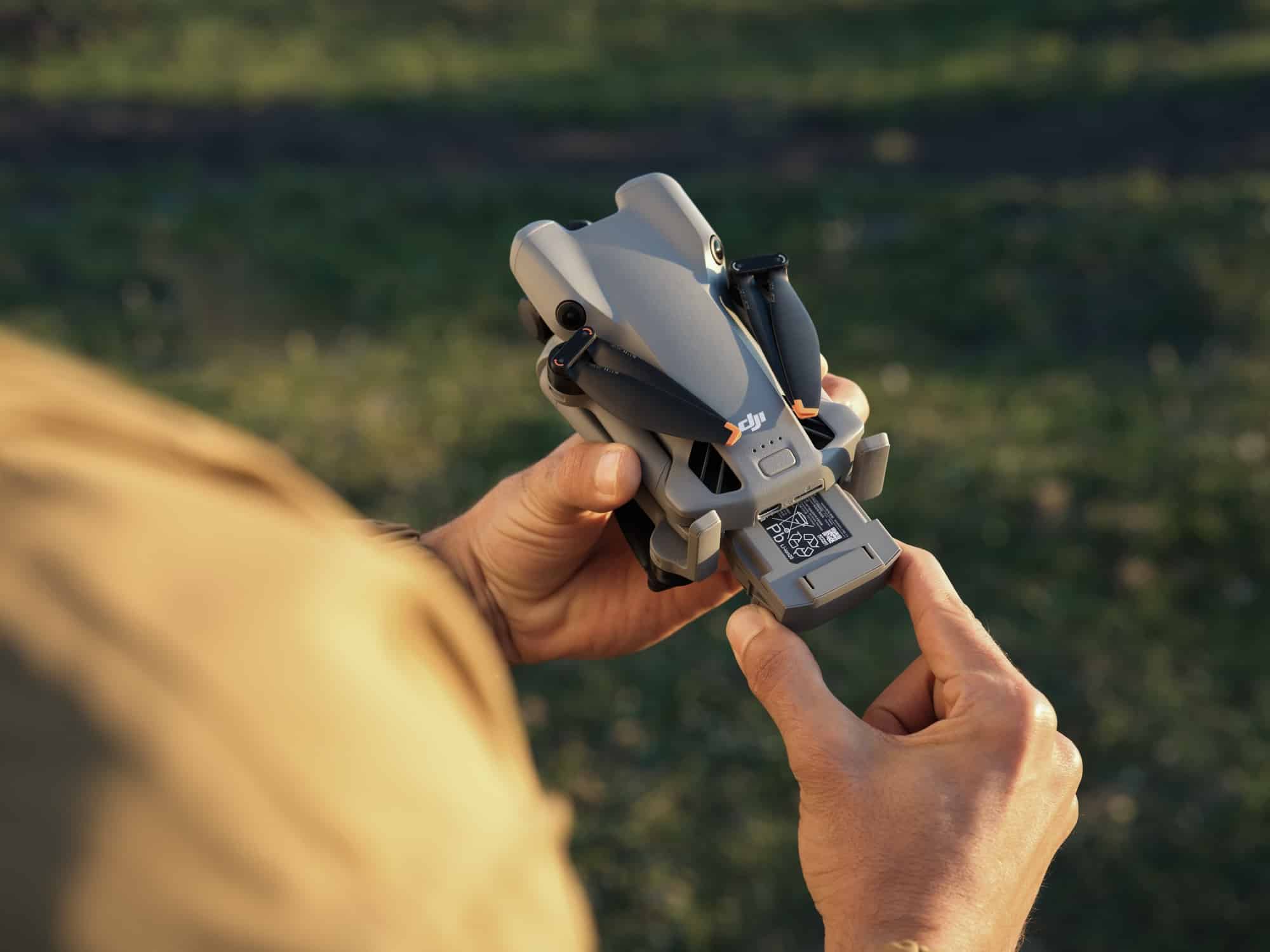 DJI Mini 5 Pro Intelligent Flight Batteries with the drone's charging hub.
