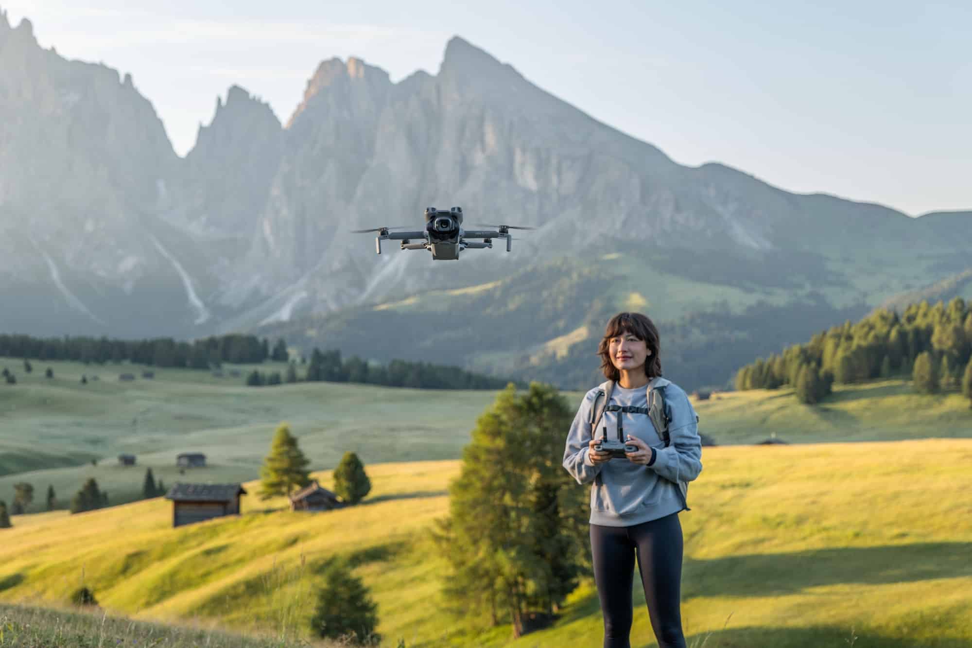 DJI Mini 5 Pro accompanying a hiker in DJI lifestyle photography.