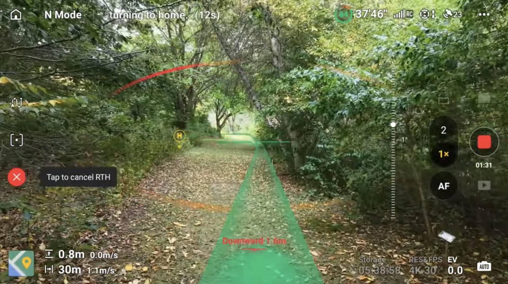 Controller view during return-to-home along a leafy trail, with a cancel prompt showing.