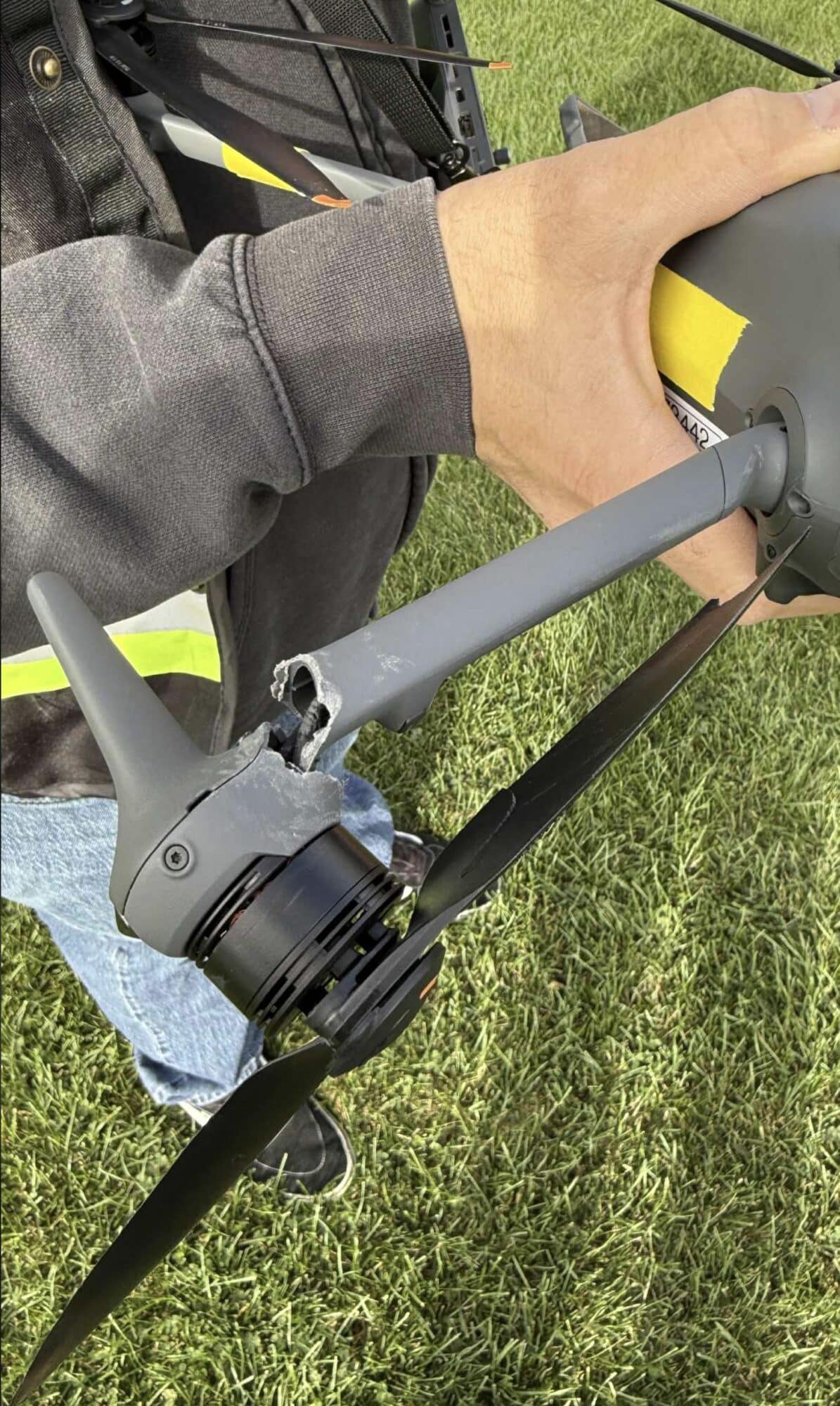 The crashed DJI Mavic 4 Pro on the ground with one arm broken off.