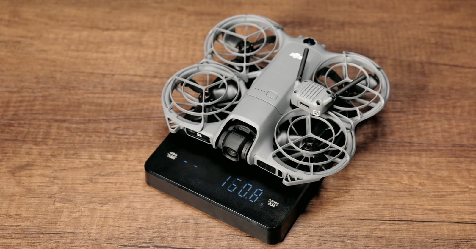 With the O4 transmission module fitted, the scale climbs to 160.8 grams.