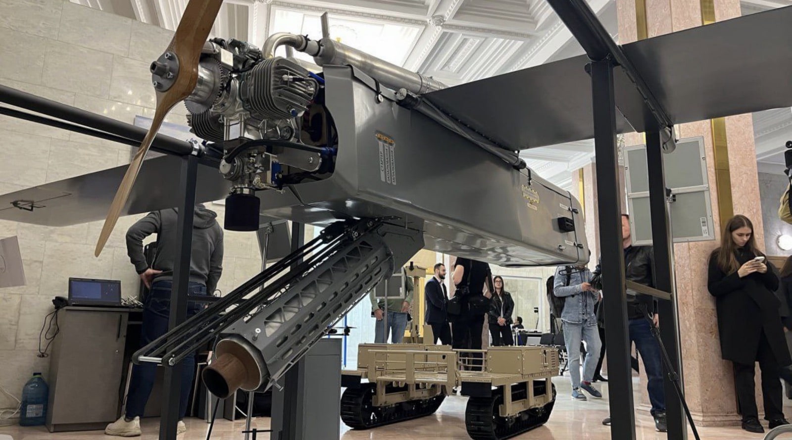 Close-up of the FP-1's engine and pusher propeller above its launch rail.