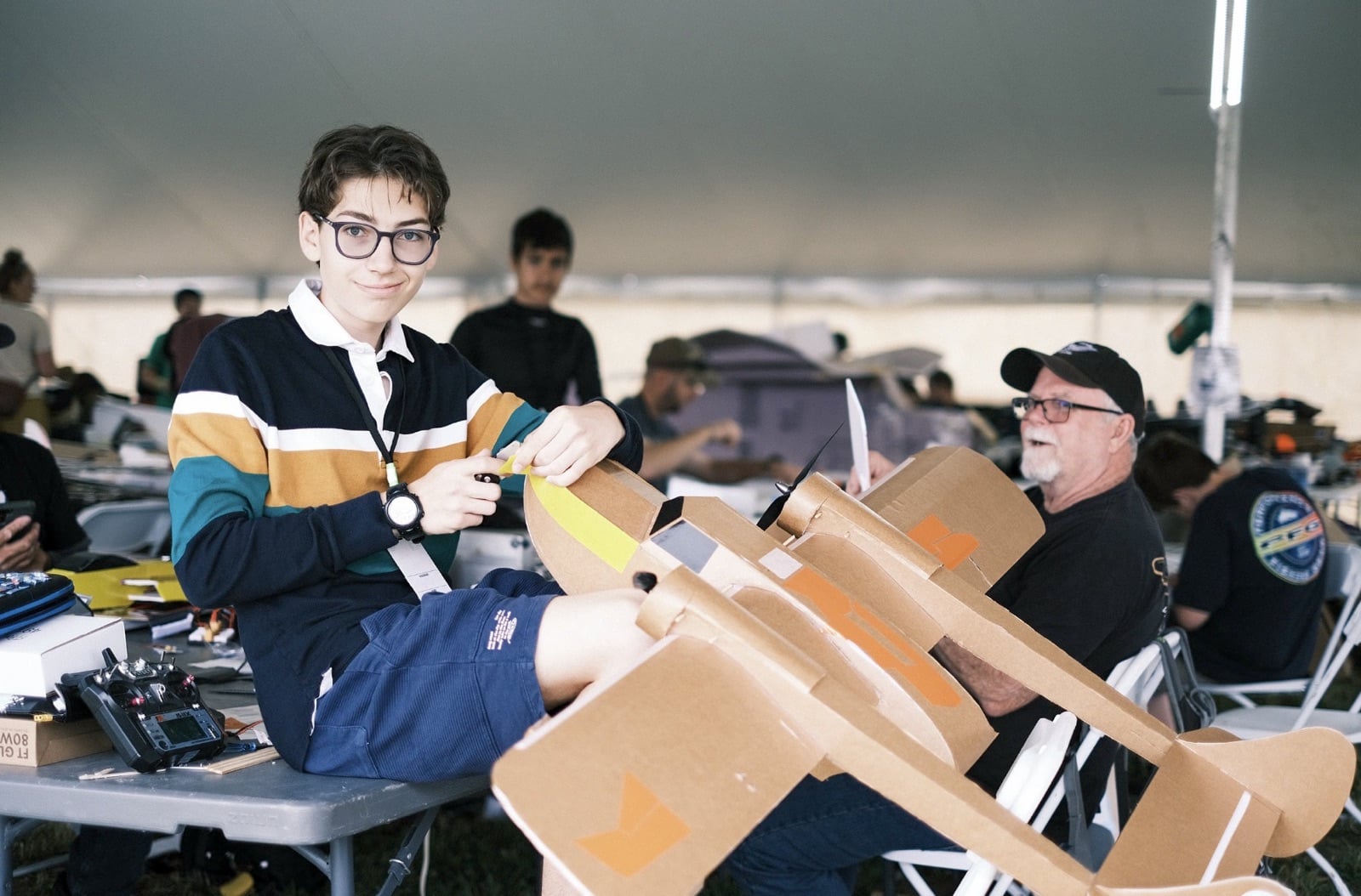 Parked model aircraft filling the pit area at Flite Fest 2023.