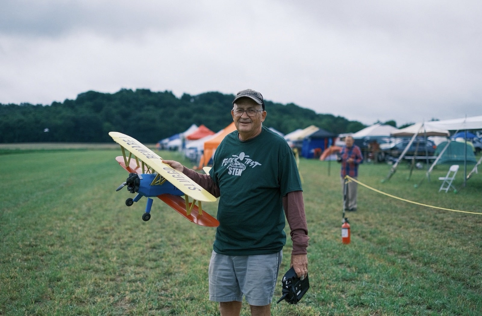 Model aircraft queued at the edge of the runway during Flite Fest 2023.