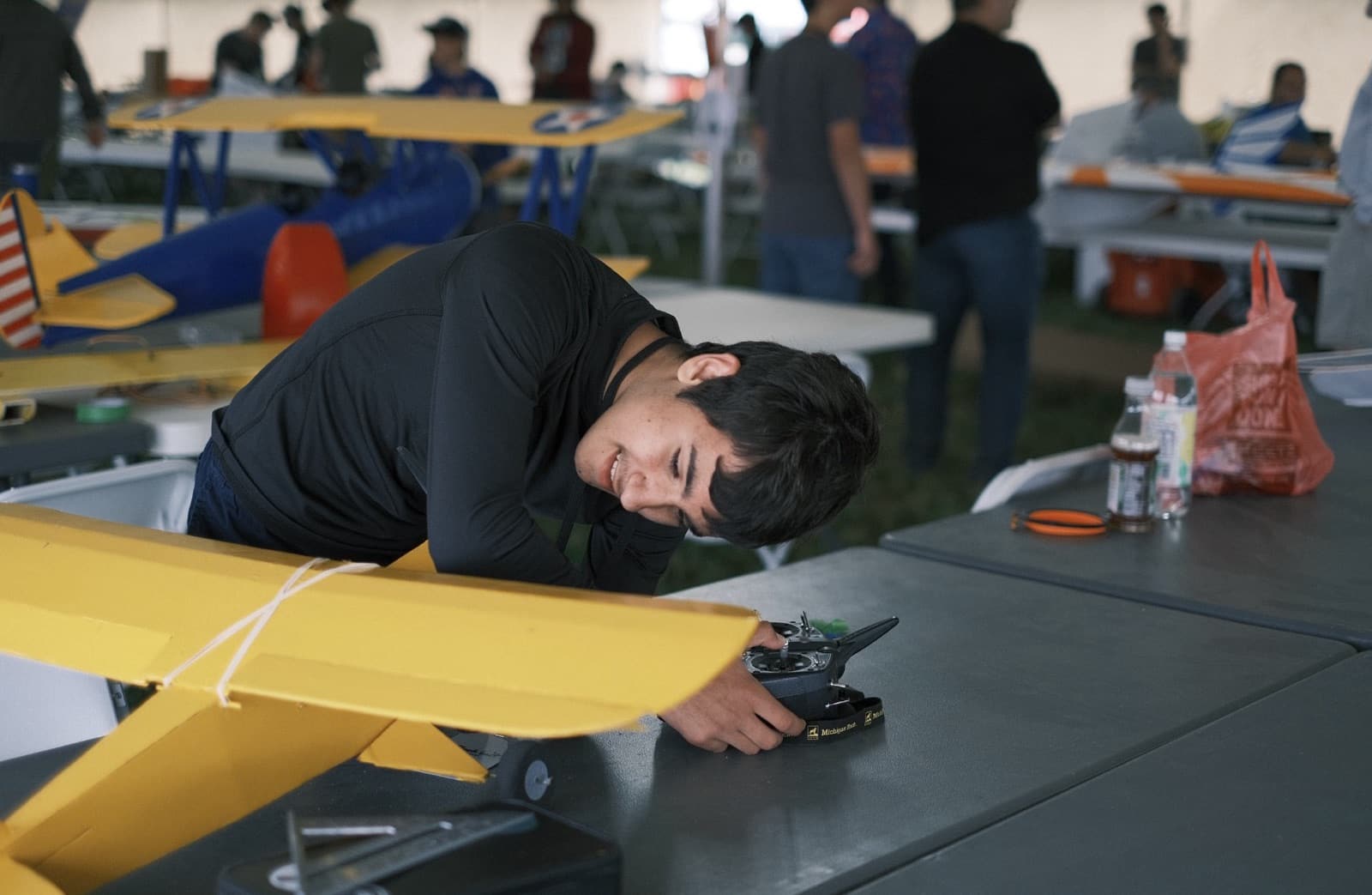Tools and spare parts covering a pilot station table at Flite Fest 2023.