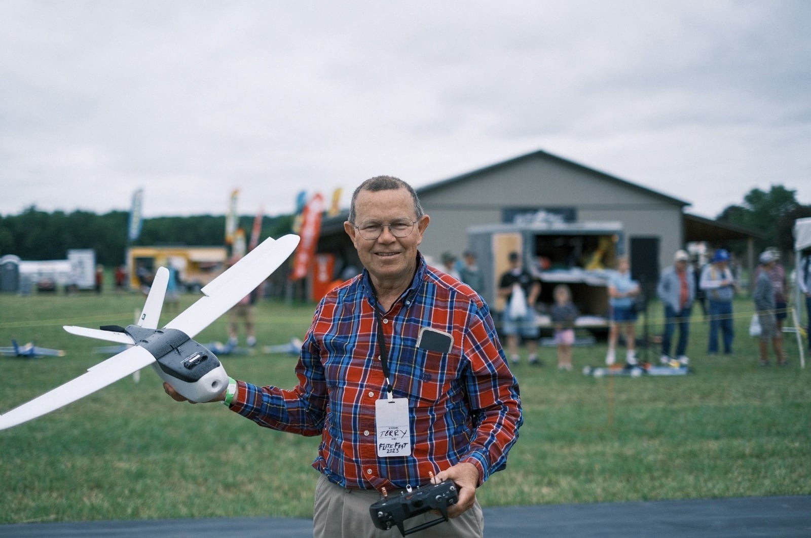 Attendees gathered around a build demonstration at Flite Fest 2023.