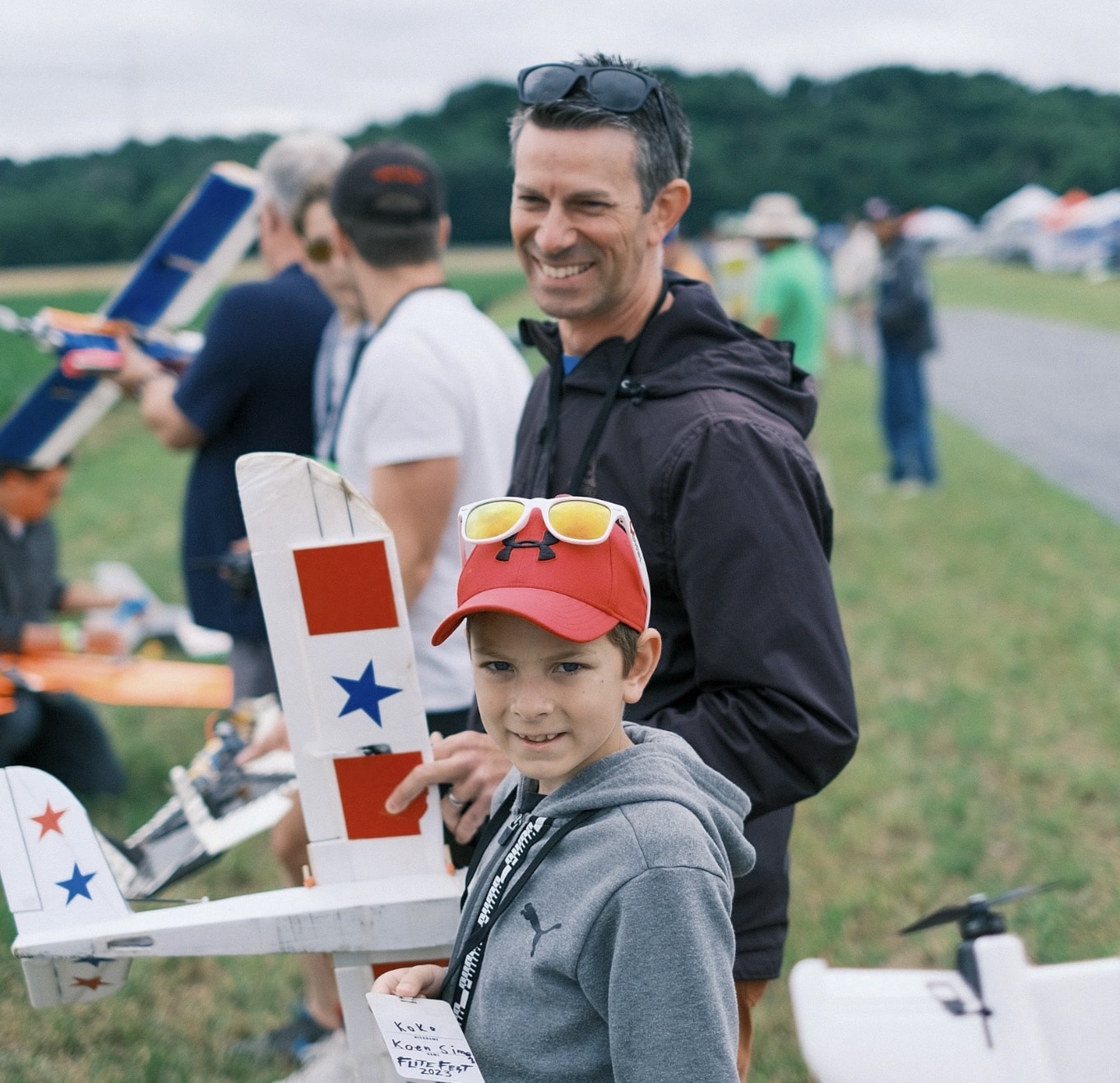 A model aircraft touching down on the grass strip at Flite Fest 2023.