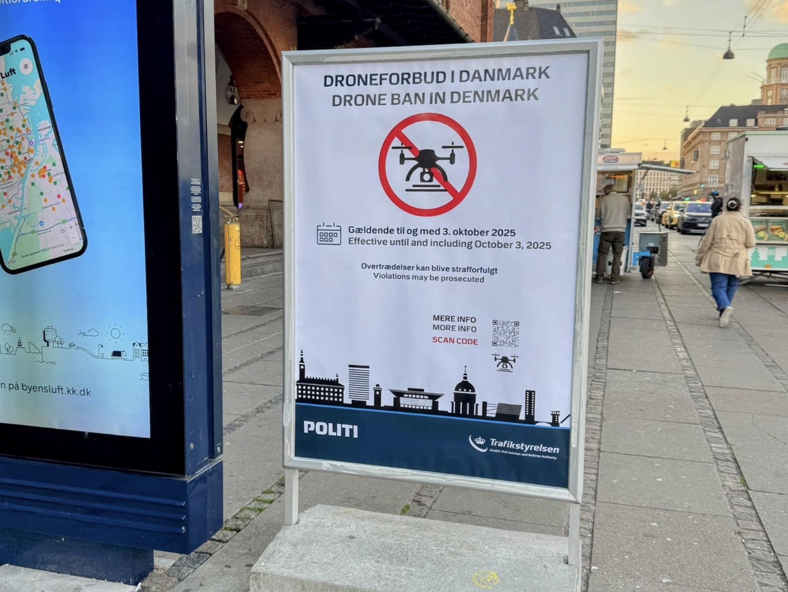 Danish drone ban poster displayed on a Copenhagen street sign board.