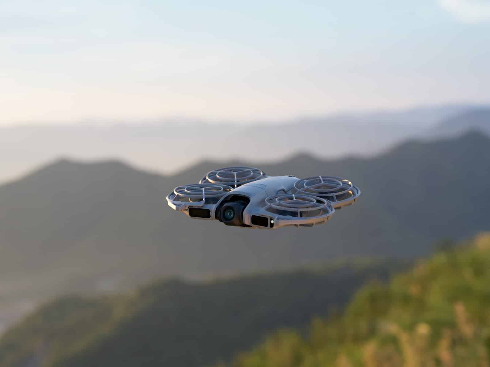 DJI Neo 2 resting in a hand, showing its 5.3-ounce (151-gram) frame.