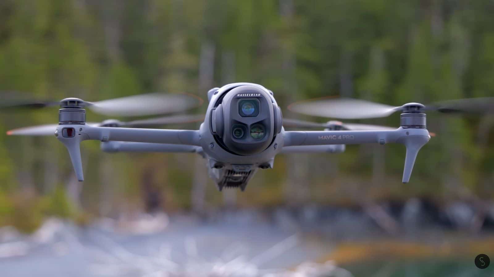 DJI Mavic 4 Pro in flight with its triple-camera gimbal facing forward.