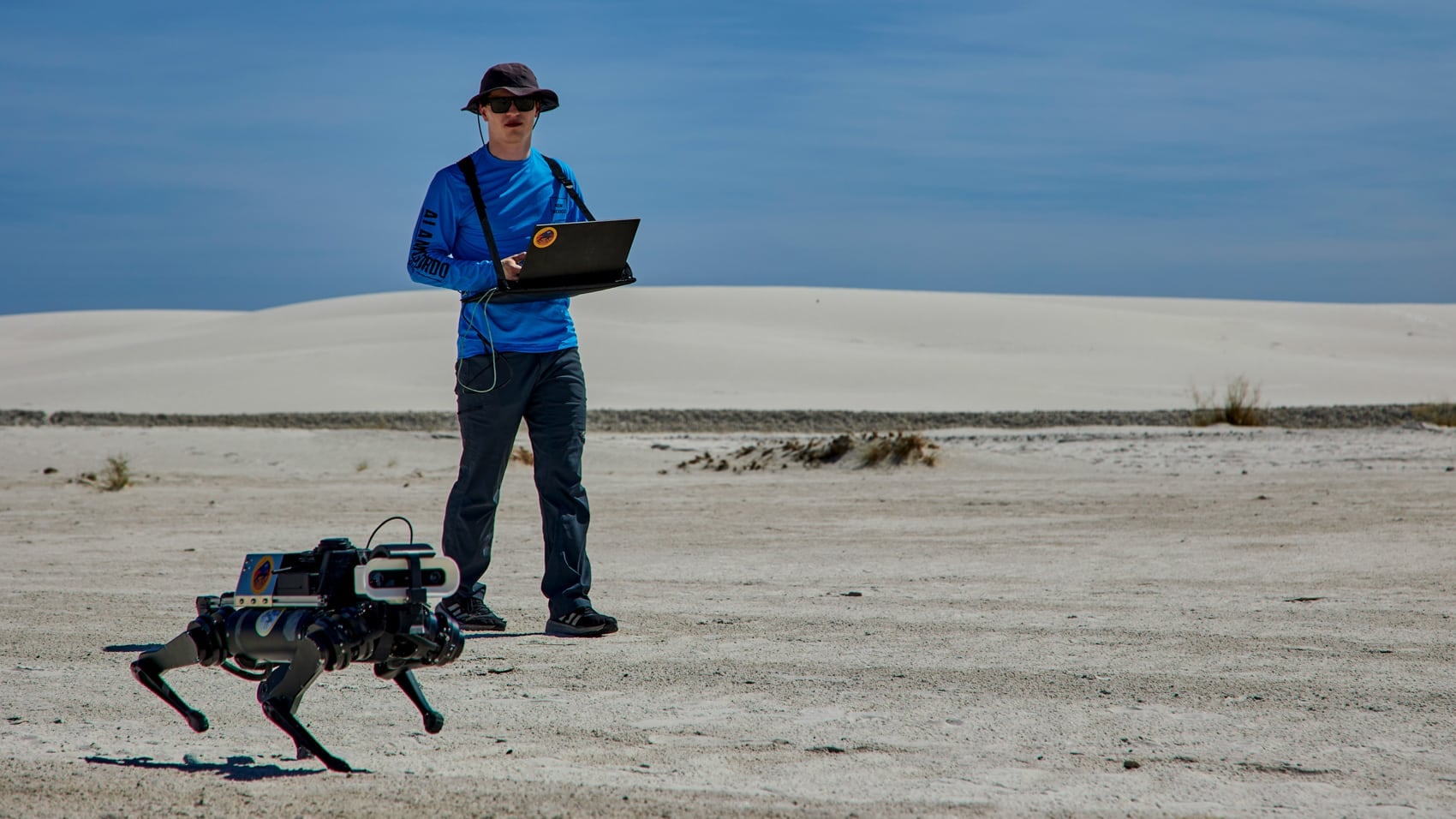 The LASSIE M robot dog walking across the gypsum sand at White Sands.