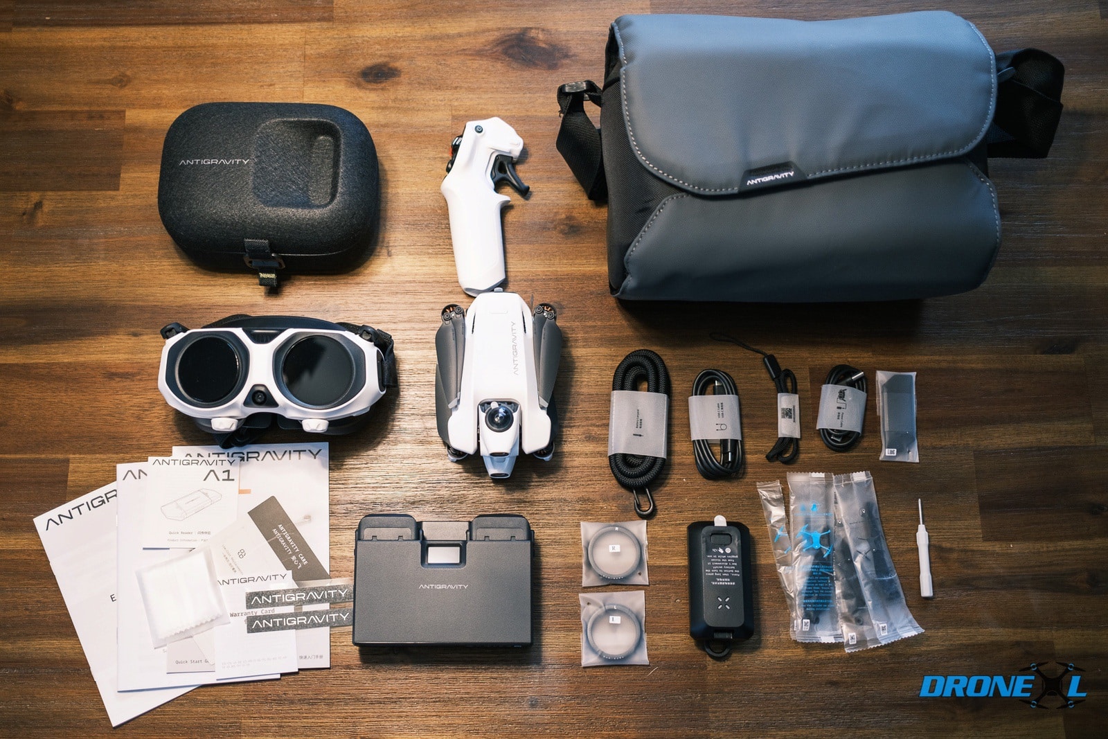 The full Antigravity A1 Infinity Bundle with its folding three-battery charging hub.