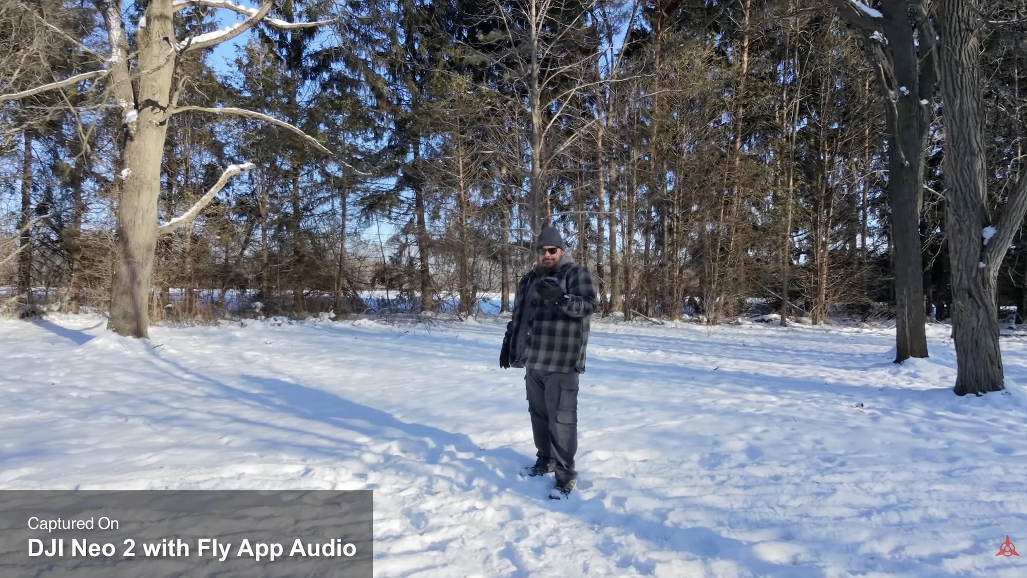 Snowy forest trail frame captured with the Neo 2 and Fly app audio.