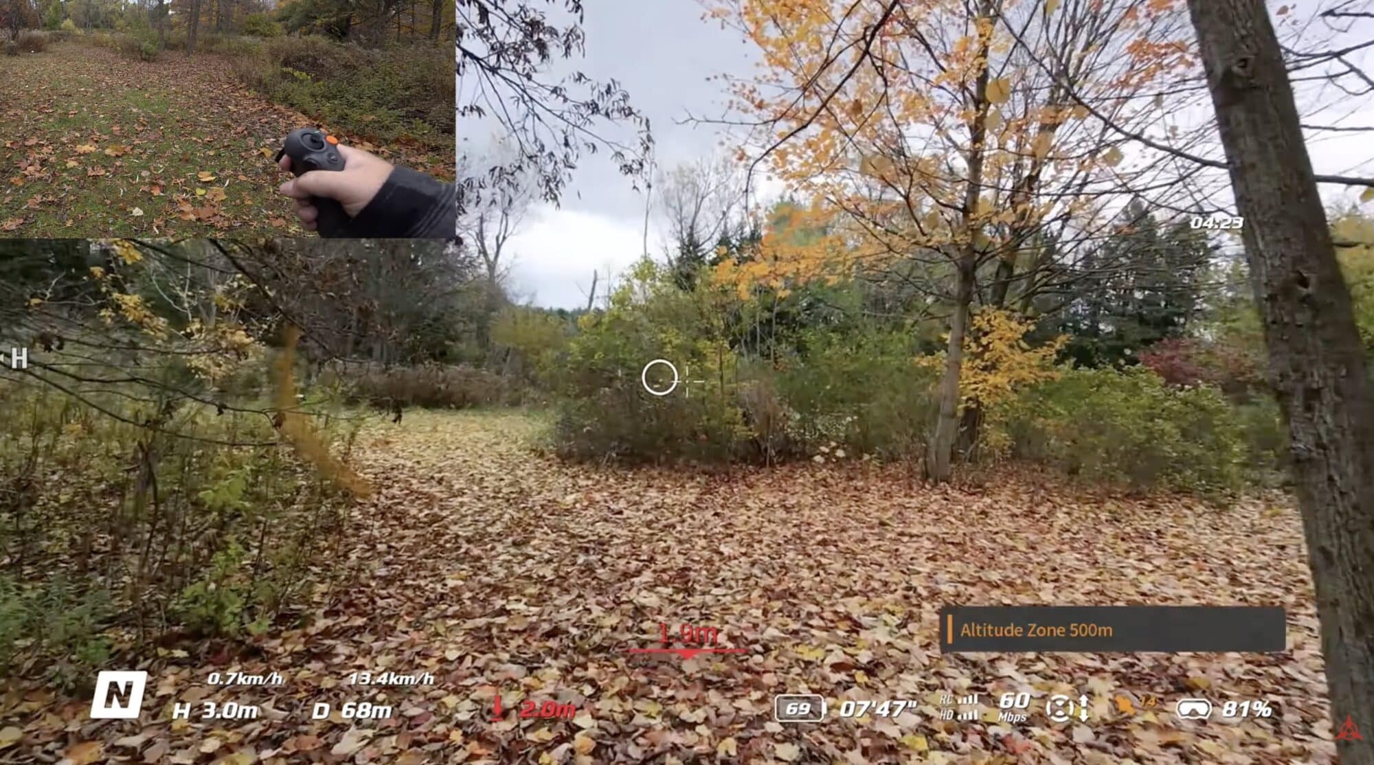 Goggles view of a leaf-covered forest trail with flight telemetry and pilot inset.