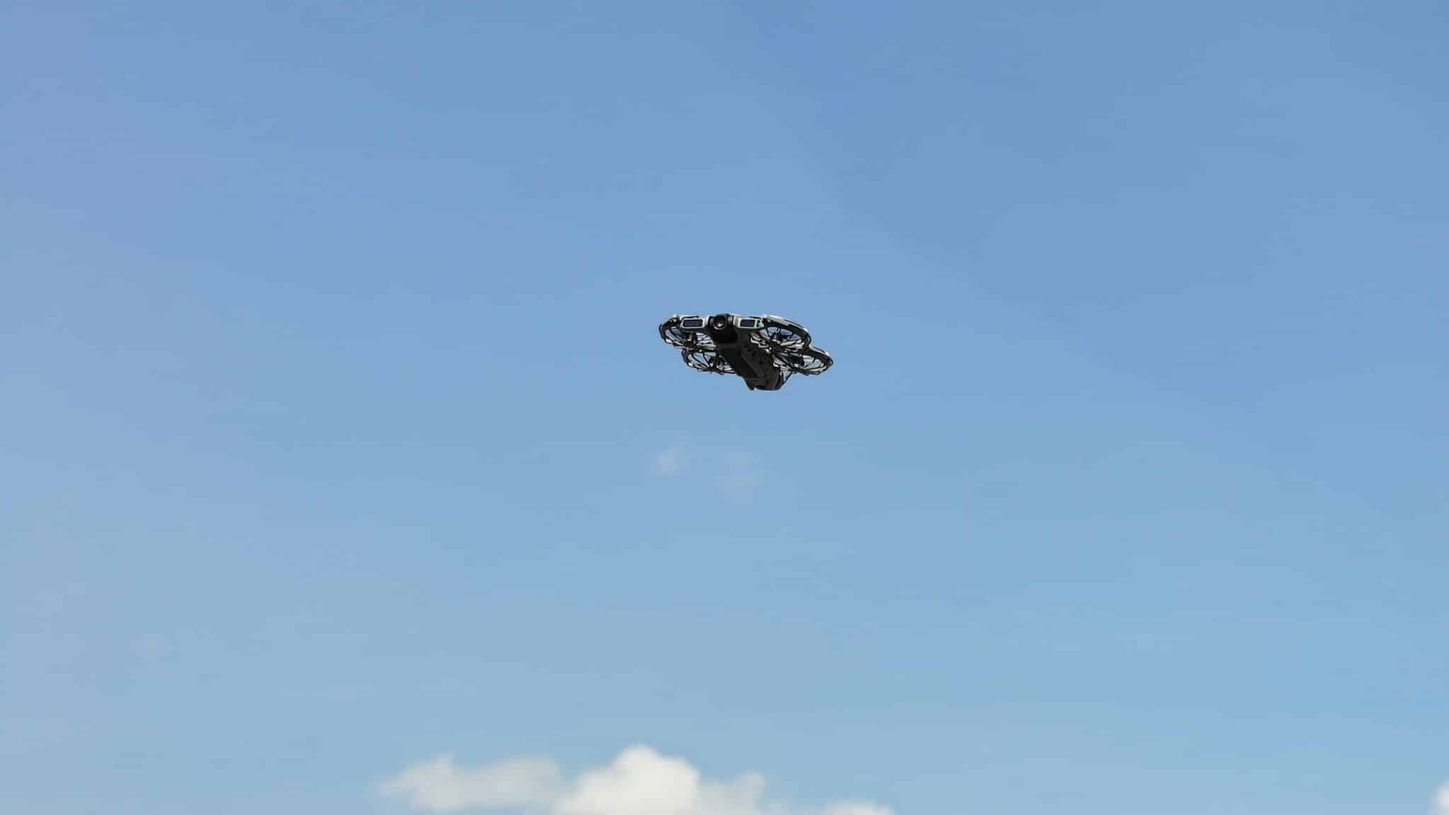The DJI Neo 2 flying back toward the camera at the end of a shot.