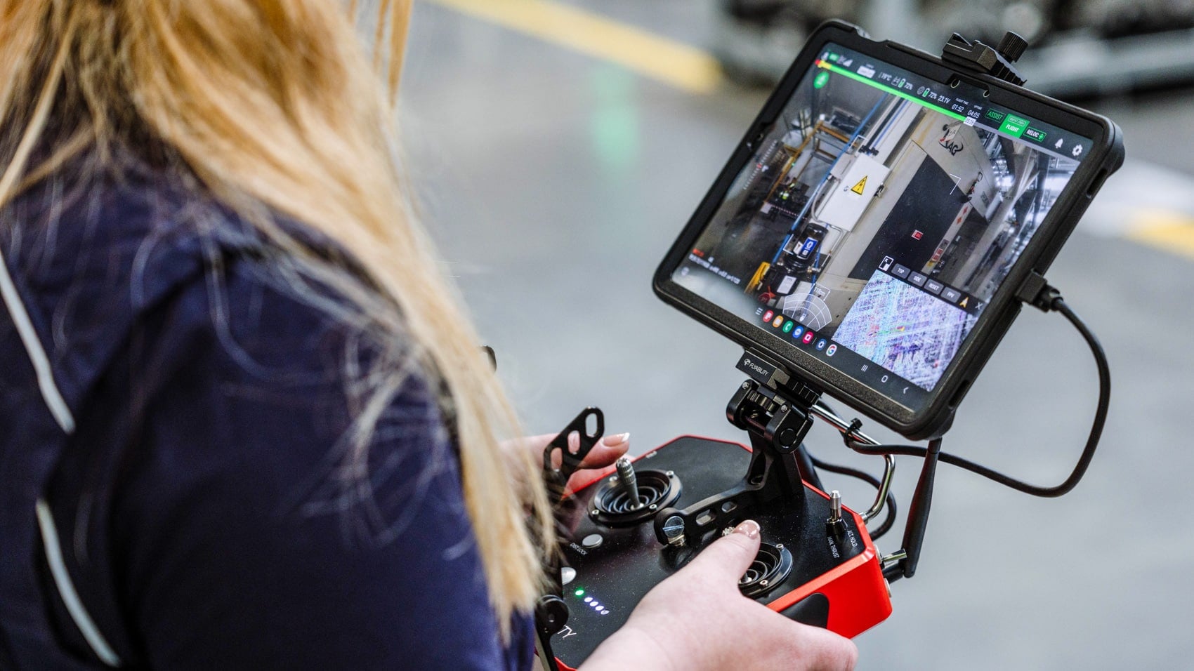 JLR staff operating the caged Elios 3 from the floor of the manufacturing centre.