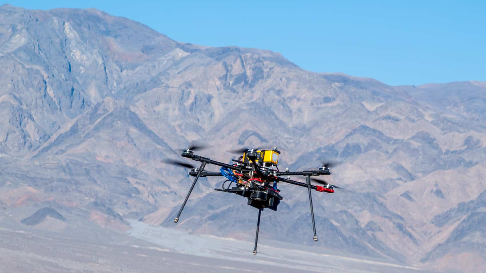 A NASA research drone in test flight over Mars Hill in Death Valley.