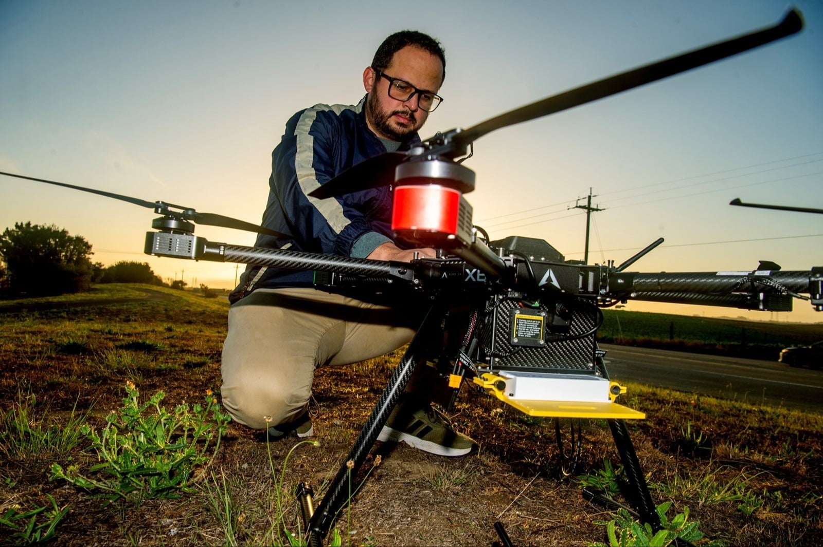 Javier Gonzalez-Rocha, Assistant Professor at UC Santa Cruz, is doing a preflight check on a custom drone built to analyze air quality and pollution
