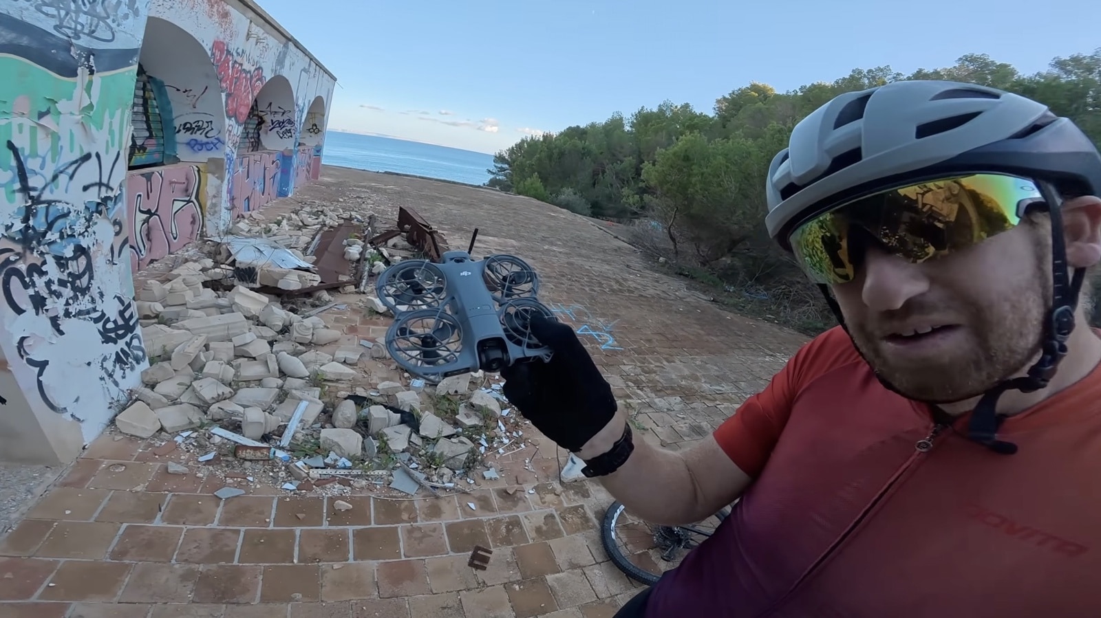 Neo 2 following the rider through the abandoned resort down to the ocean.