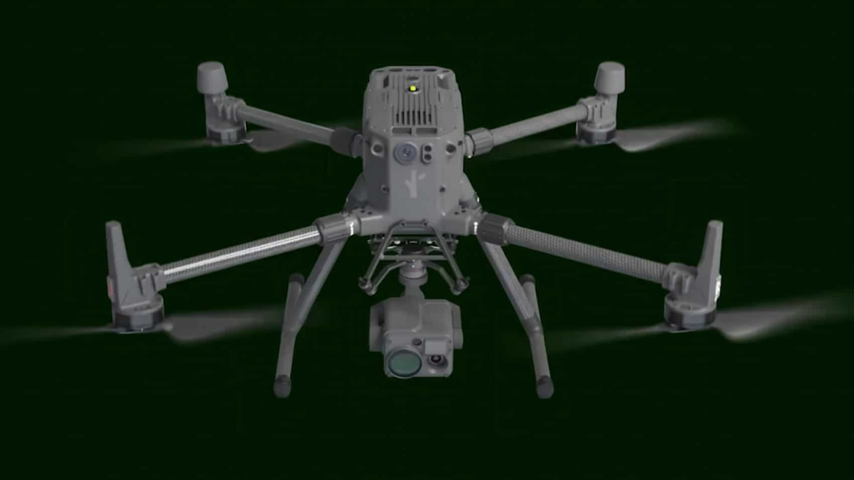 The Flock Alpha quadcopter hovers against a dark background with its gimbal camera visible.