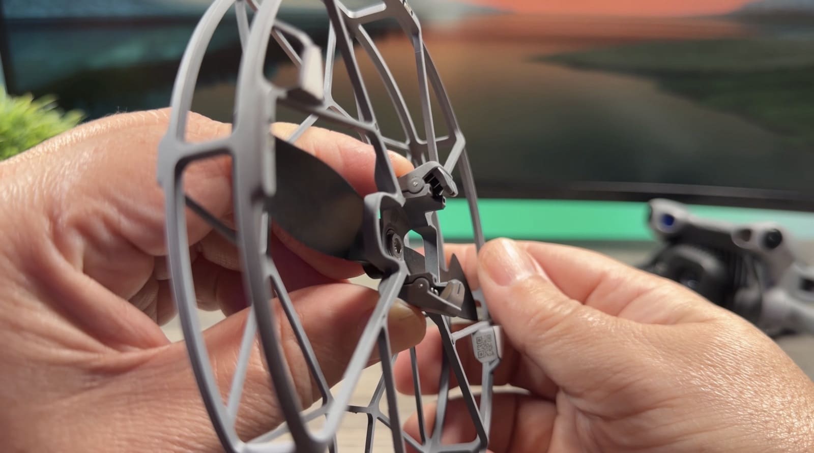 A prop guard clipping into the grooves on a DJI Mini 5 Pro motor arm.