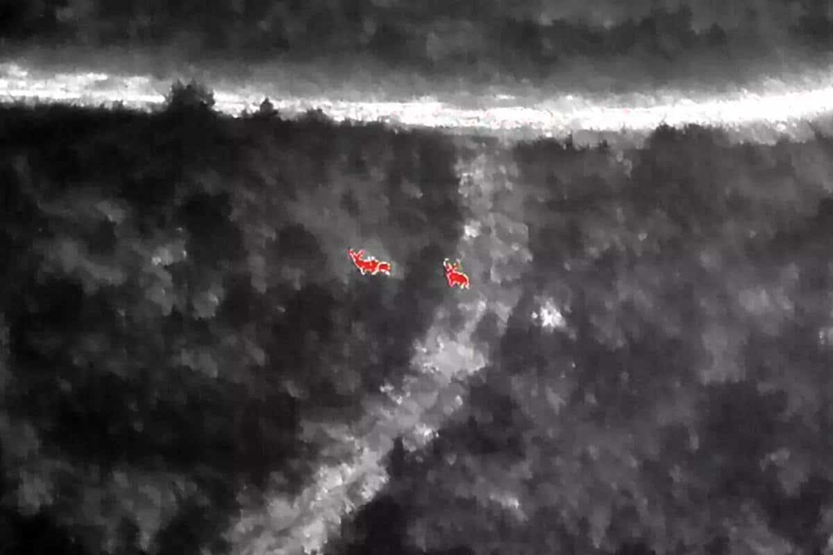 A drone pilot searching for a downed deer, photographed by Justin Updyke.