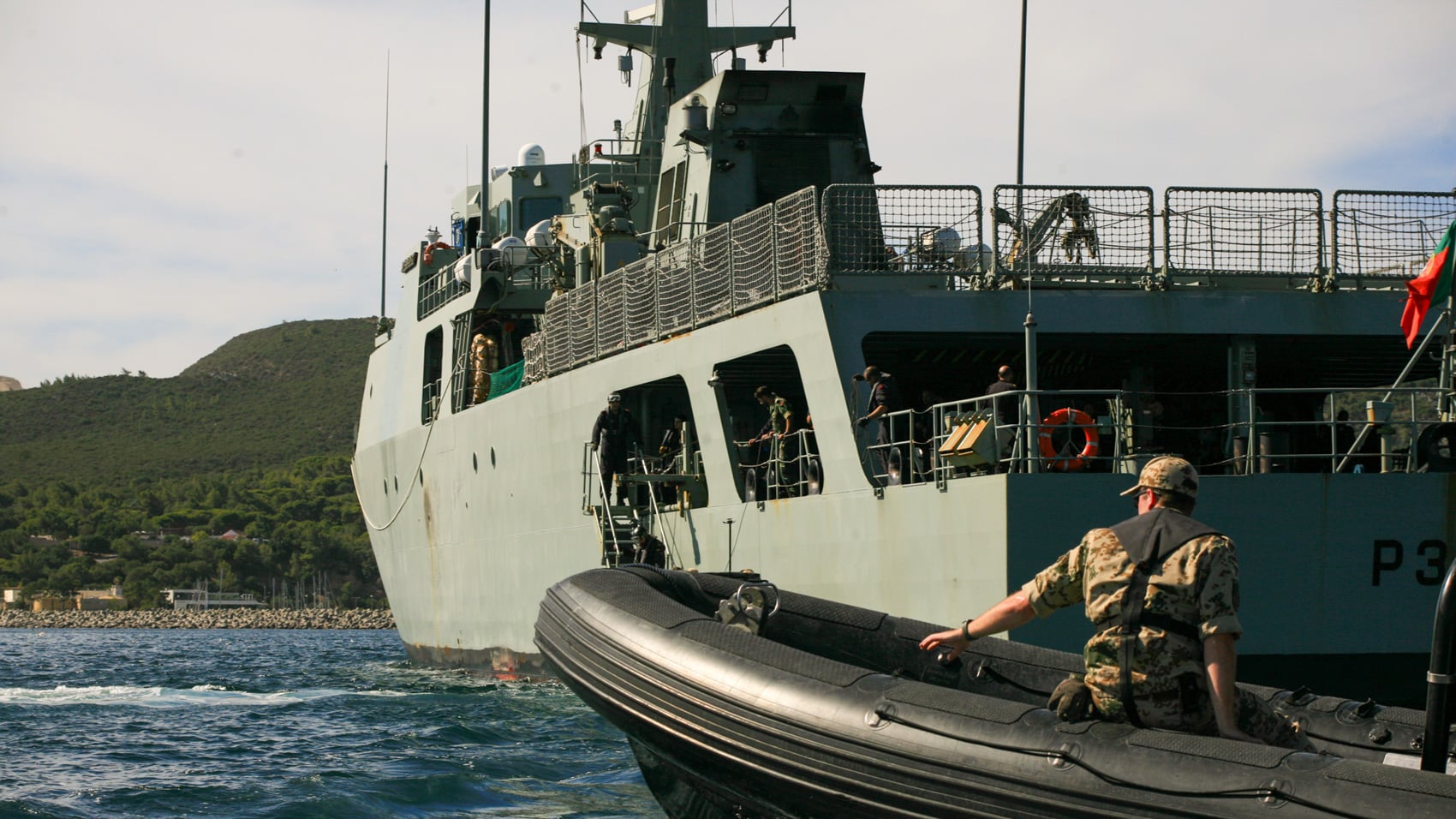 Crew recovering an autonomous underwater vehicle after a coordinated swarm run.